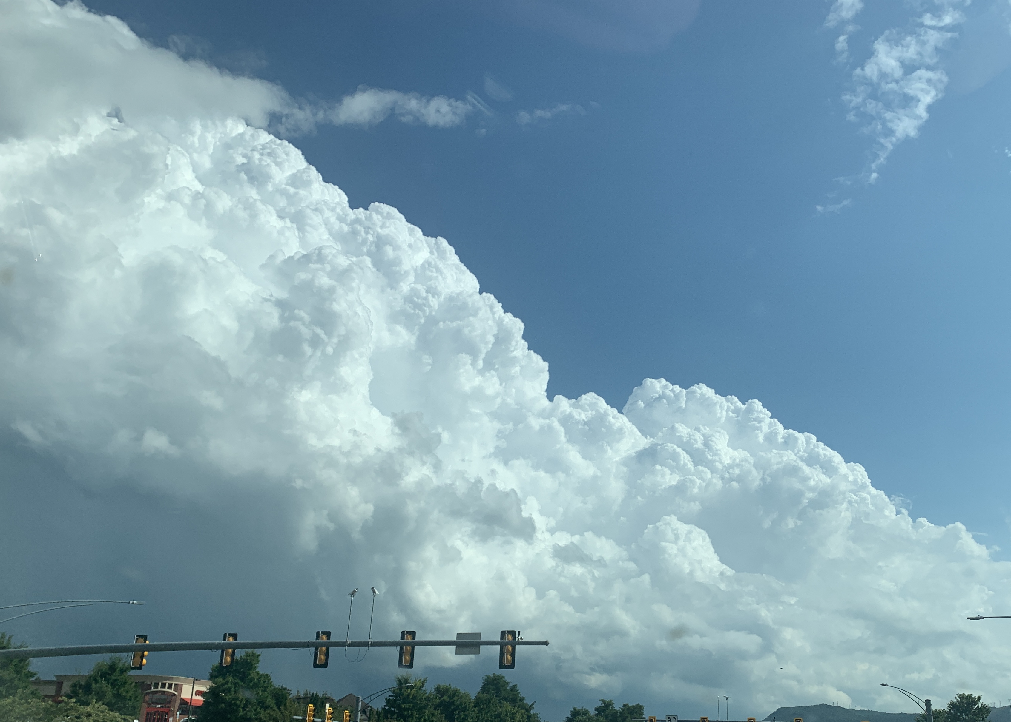 Strong updrafts lift crisp, bubbly towering cumulus clouds over the Roanoke Valley, as seen from the Daleville area of Botetourt County, looking south. This developed into a pulse storm that dumped 3+ inches of rain in an hour on parts of eastern Roanoke city and Vinton, while locations only a few miles away got no significant rainfall. Photo by Kevin Myatt.