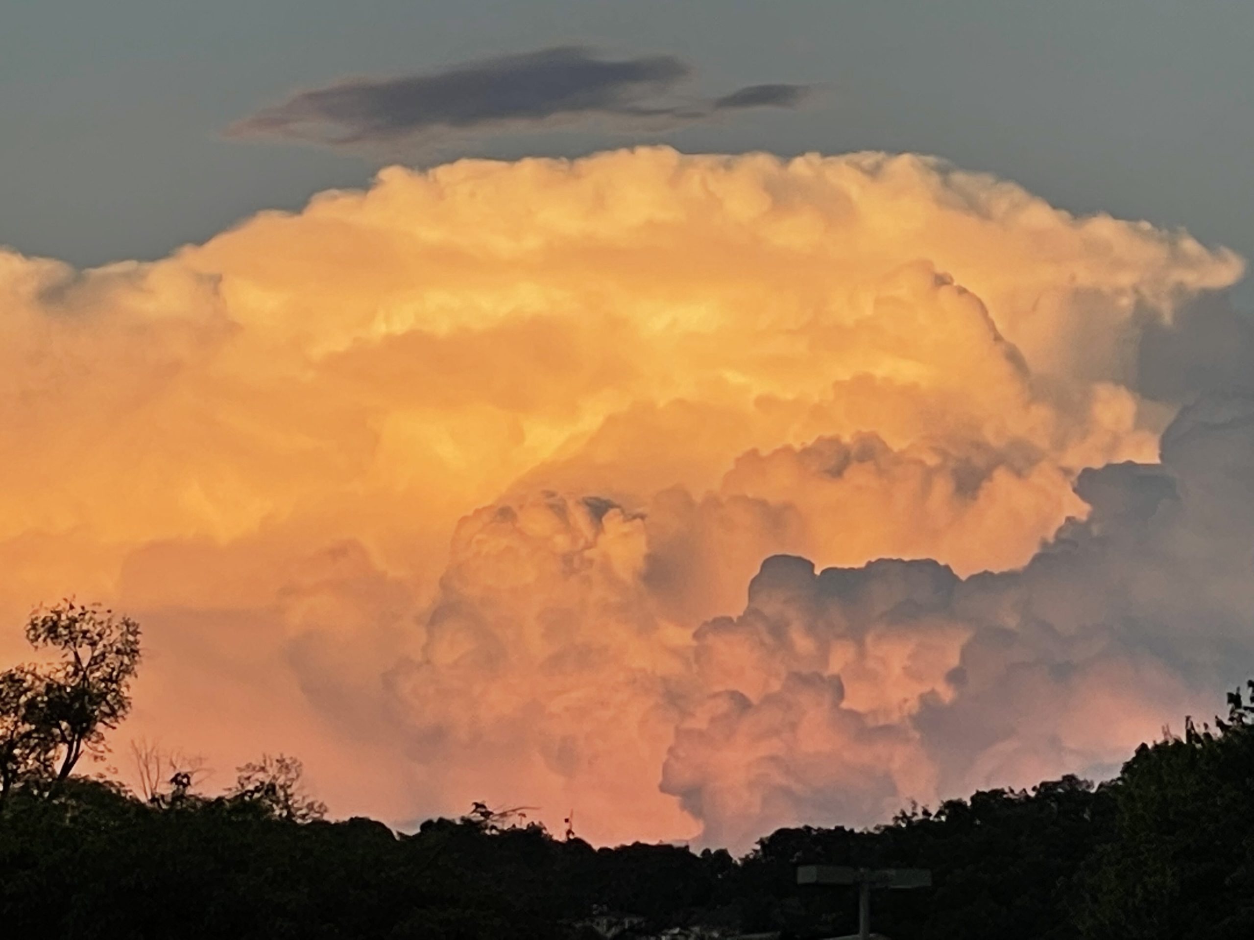 Late-day sun lights up a billowing cumulonimbus cloud on the horizon, looking east from the Roanoke Valley toward the Lynchburg area, on Monday, July 3. Heat and humidity capable of creating storms like these, and raising the heat index values, will return later this week. Photo by Erica Myatt.