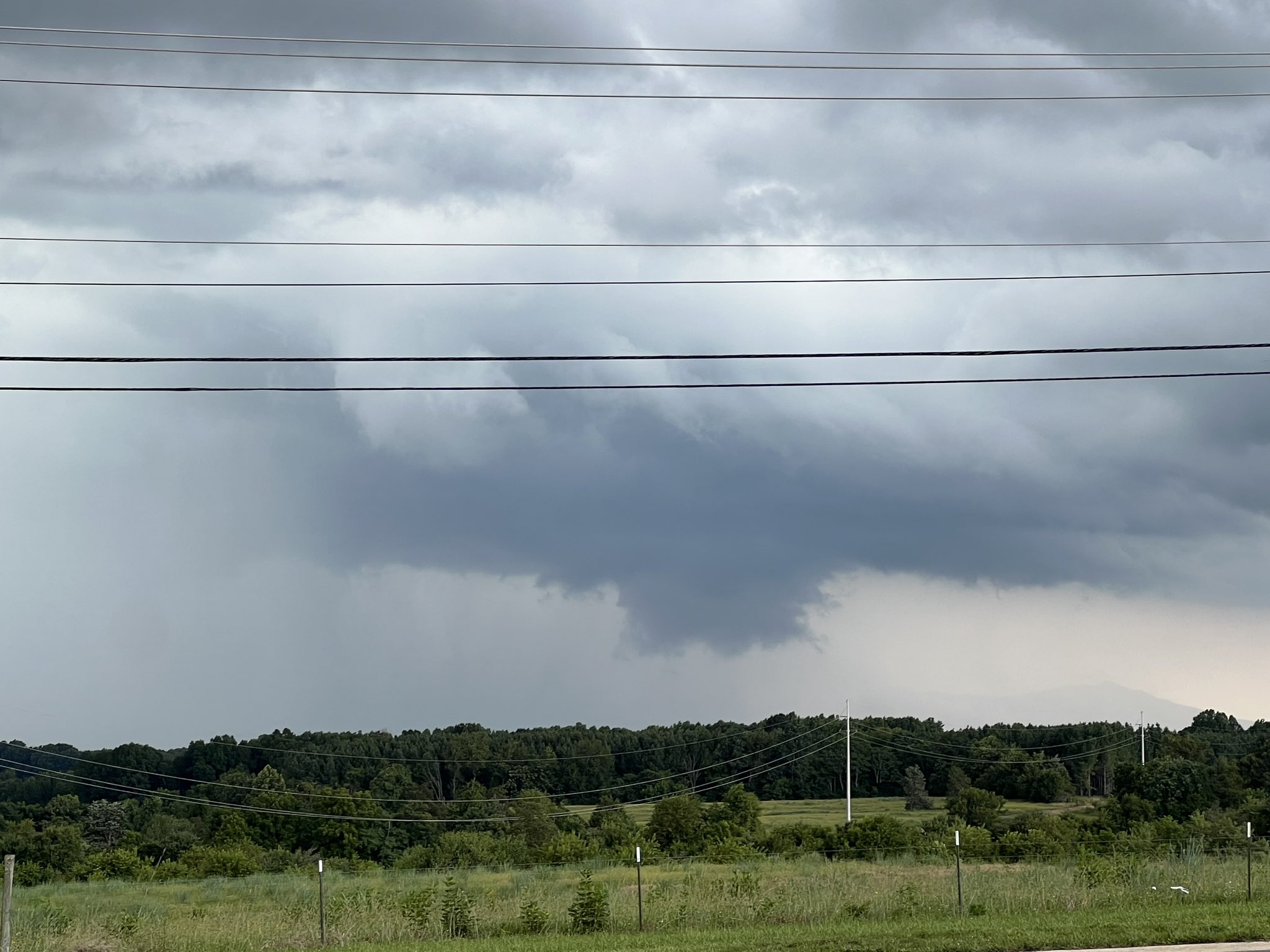 A squared lowering cloud mass beneath the thunderstorm base is a classic wall cloud formation, common in supercell thunderstorms, as seen near Forest on Saturday, July 15. Courtesy of Chris Manley.