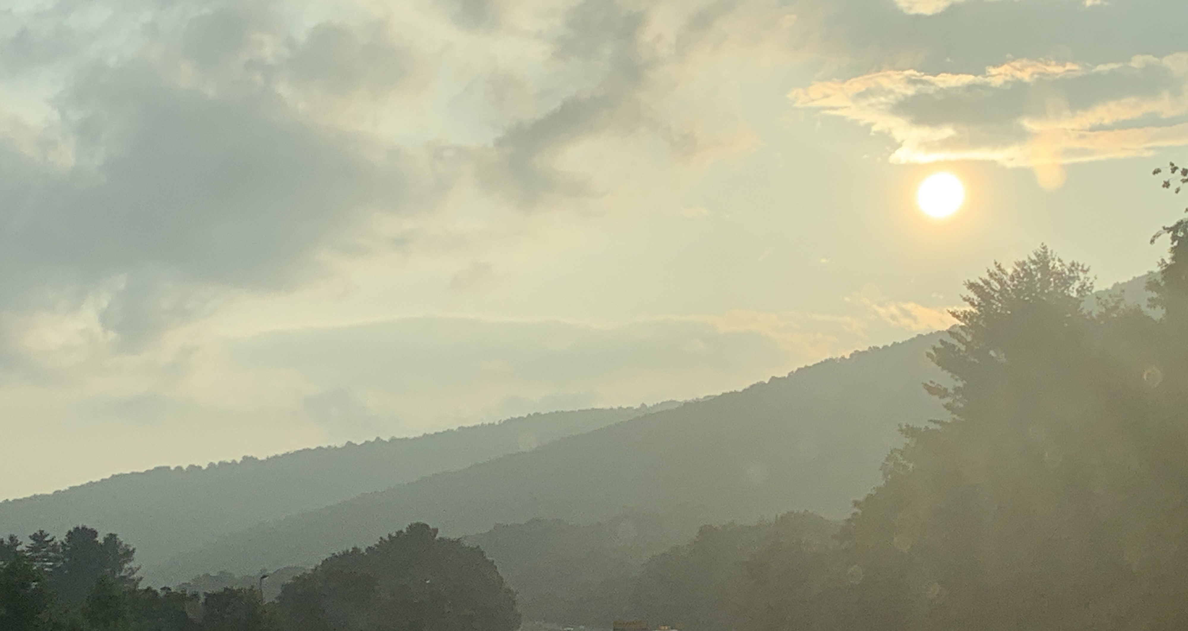 Canadian wildfire smoke produces haze graying the Blue Ridge and partially obscuring the sun along Interstate 64 near Charlottesville on Friday, June 30. Photo by Kevin Myatt.
