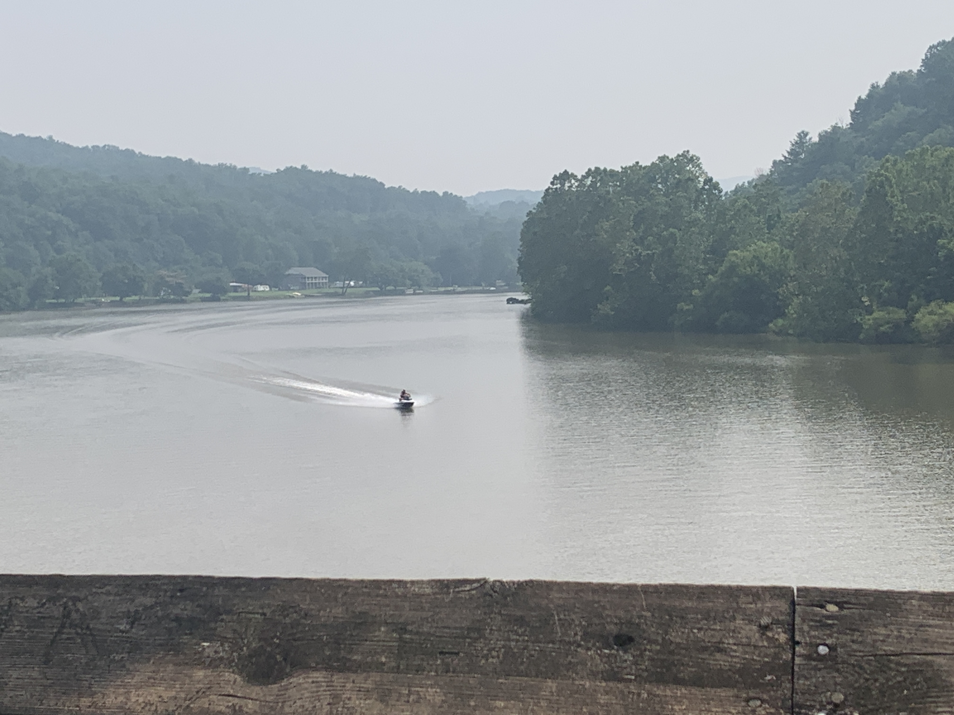 A jet ski plies the waters of the New River as seen from the Hiwassee River Bridge of the New River Trail in Pulaski County earlier this month. Water activities will likely be popular in the latter part of this week as many locations in Southwest and Southside Virginia have multiple days of highs in the 90s. Photo by Kevin Myatt