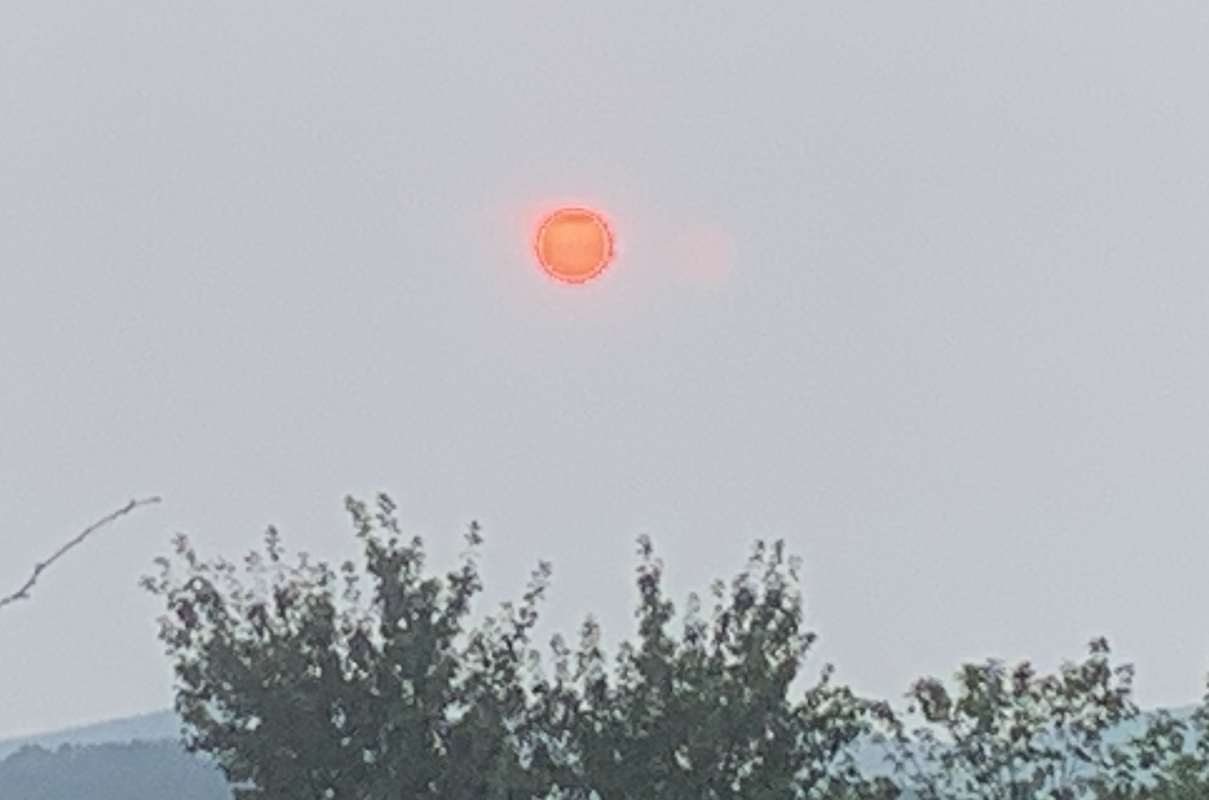 Morning sun shines through a layer of Canadian wildfire smoke earlier this month over Roanoke County. Smoke is not expected to return thickly this week, but the sun will boost temperatures to the hottest we've seen this year late this week as a "heat dome" high pressure system builds in from the west. Photo by Kevin Myatt.