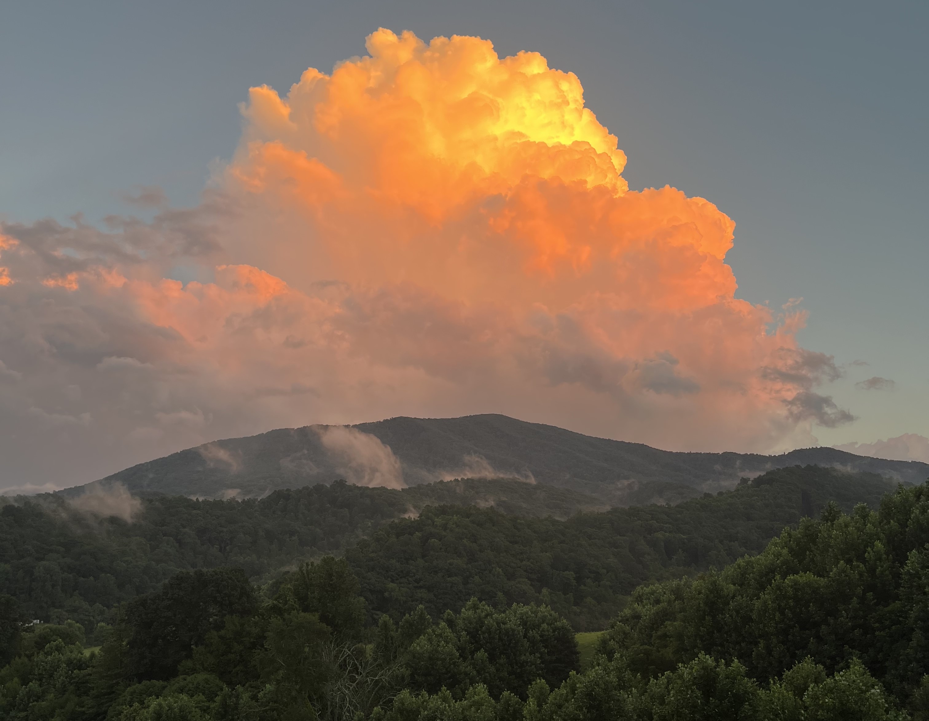 A towering cumulus cloud illuminated by late-day sunshine develops skyward over Cahas Mountain in northern Franklin County last week. Courtesy of Ben Motley.