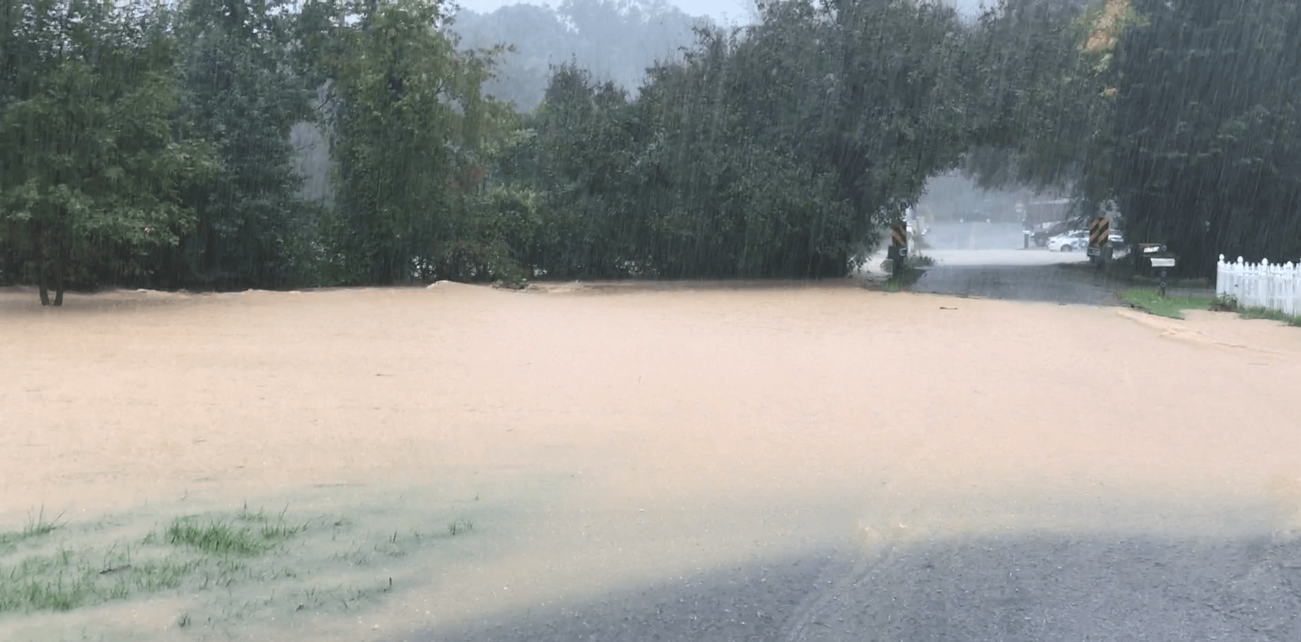 A typically tiny creek was turned into a muddy torrent by Hurricane Michael's remnants in the Crescent Heights subdivision near Starkey in southwest Roanoke County in October 2018. Photo by Kevin Myatt.