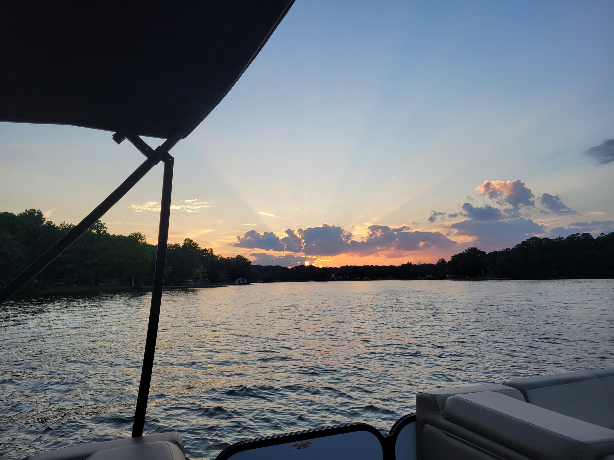 The sun sets over Smith Mountain Lake on Friday, August 11. Hotter weather is expected by next week as summer begins sinking toward it sunset. Courtesy of Chad Gilmore.
