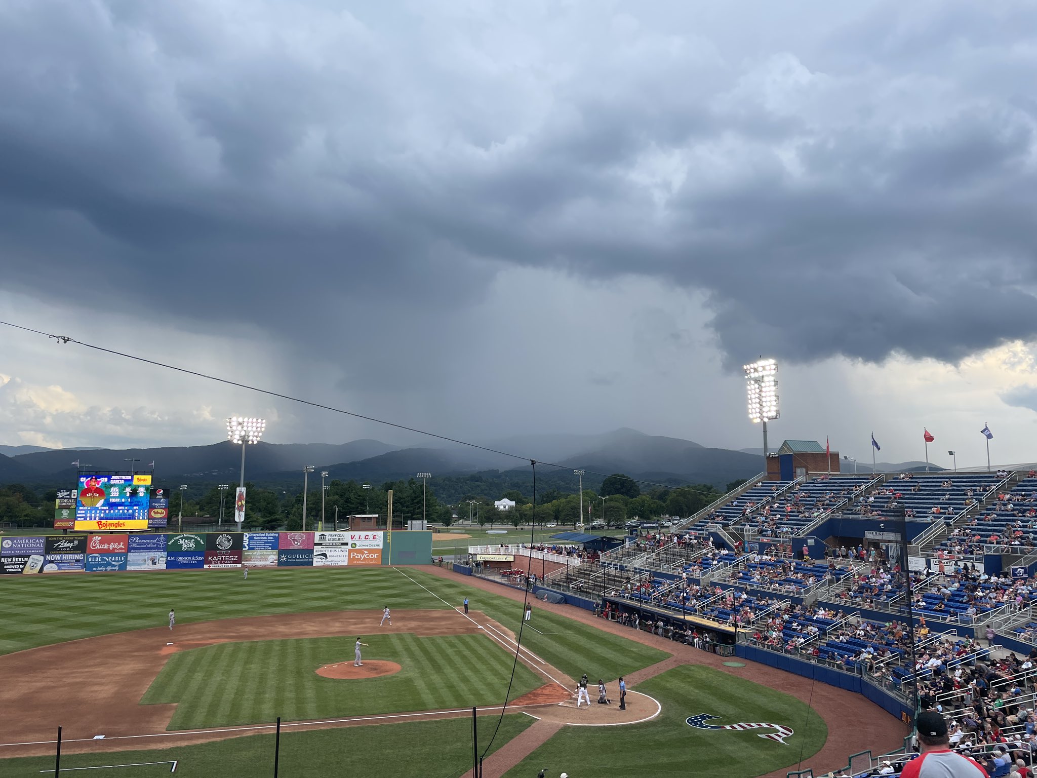 A rain shower dumps its load on Twelve O'Clock Knob and Poor Mountain as the Salem Red Sox continue to play baseball on Sunday, August 13. Photo by Judith Painter.