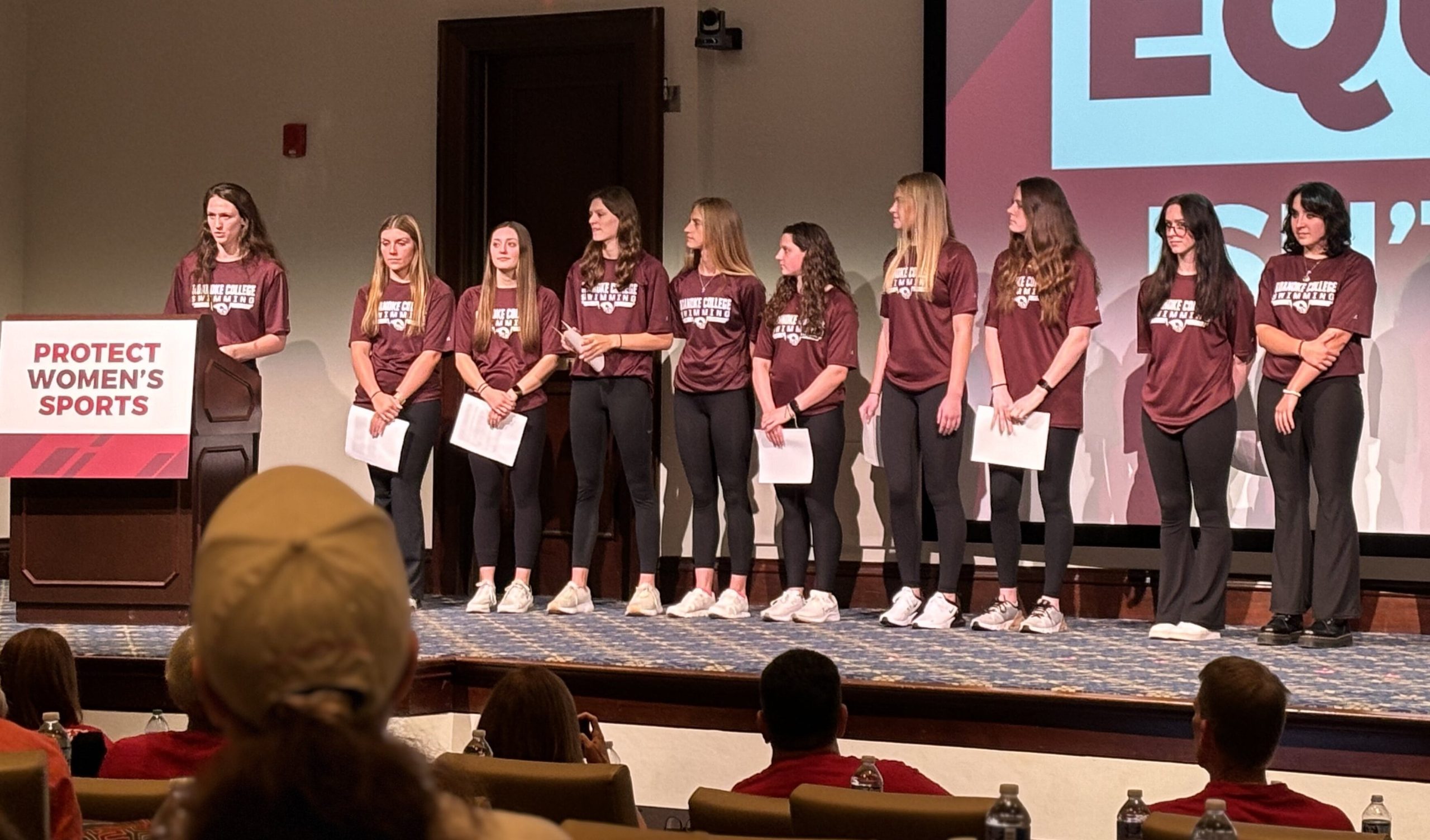 Team co-captain Lily Mullens with other members of the Roanoke College women's swim team. Photo by Emily Hemphill.