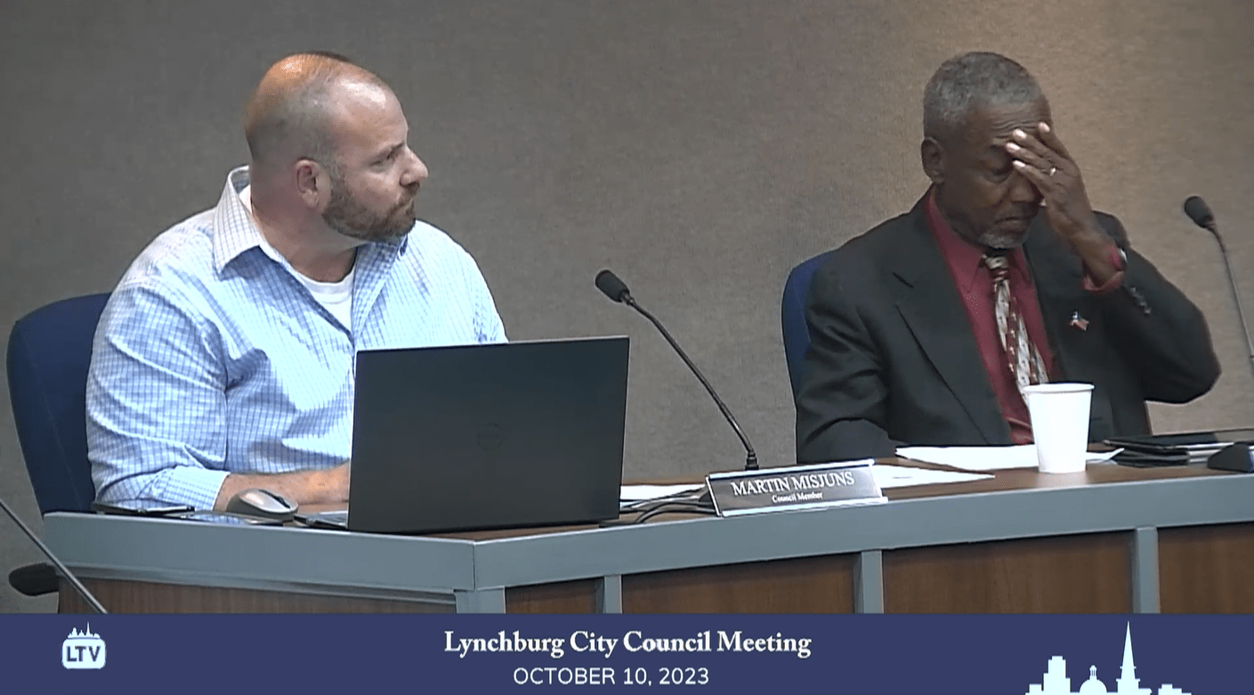 Lynchburg City Council Member Marty Misjuns (left) accuses Mayor Stephanie Reed of being out of order during council's Oct. 10 meeting. At right is council member Larry Taylor. Screenshot.