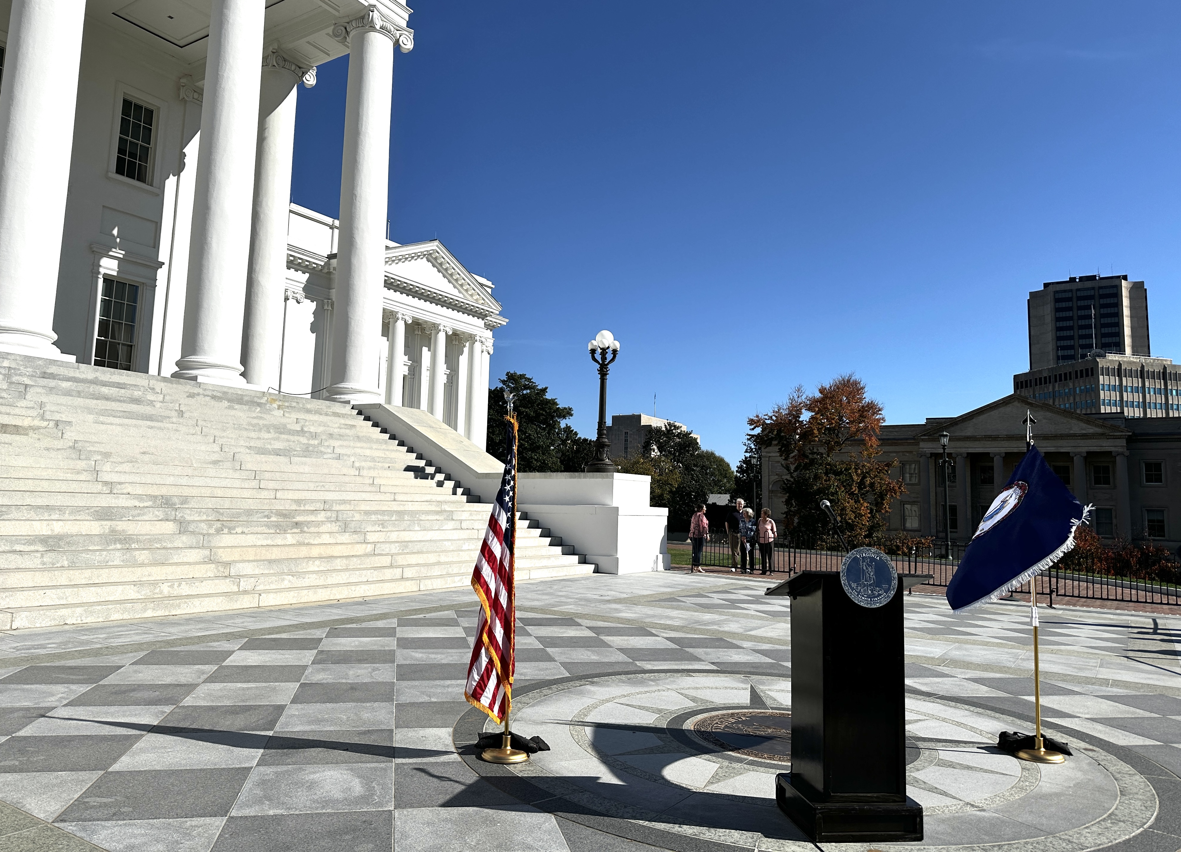 A podium set up outside the State Capitol, awaiting Gov. Glenn Youngkin. Photo by Markus Schmidt.