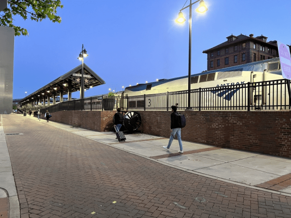 An Amtrak train at an outdoor station.
