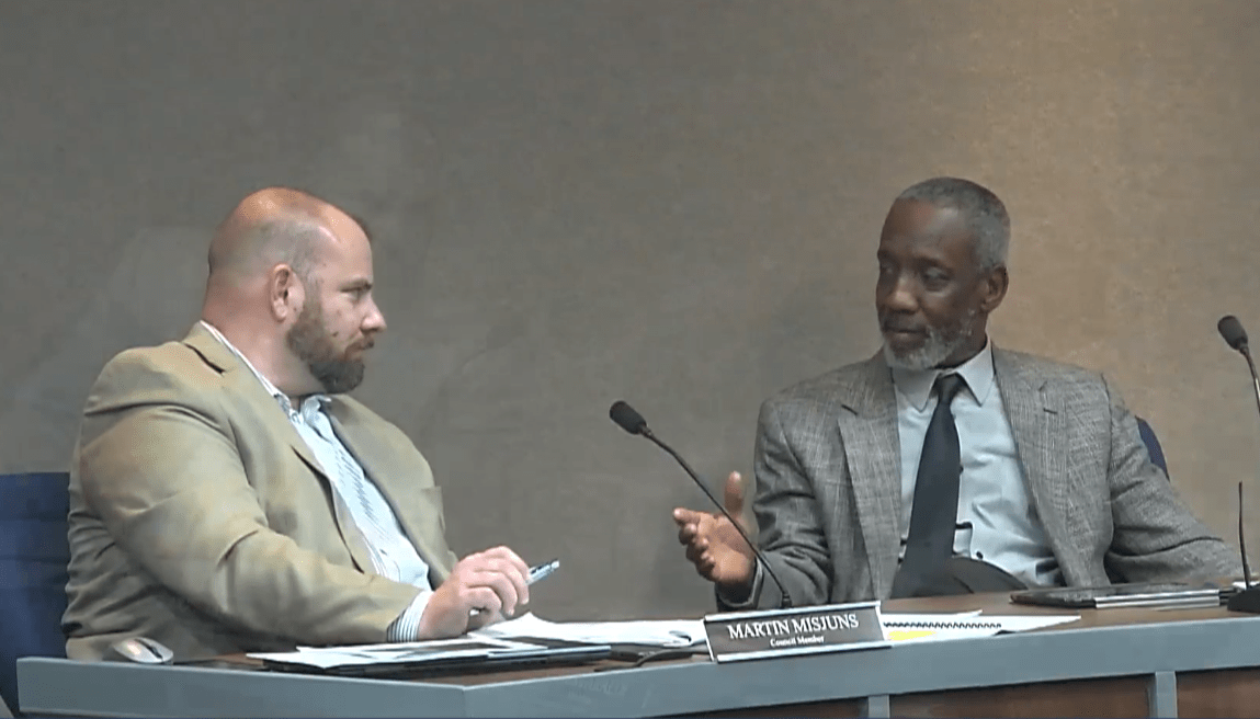 The moment where council member Larry Taylor (right) tells Marty Misjuns (left) that "I love you, brother, but your attitude has been out of order.” Screenshot of livestream.