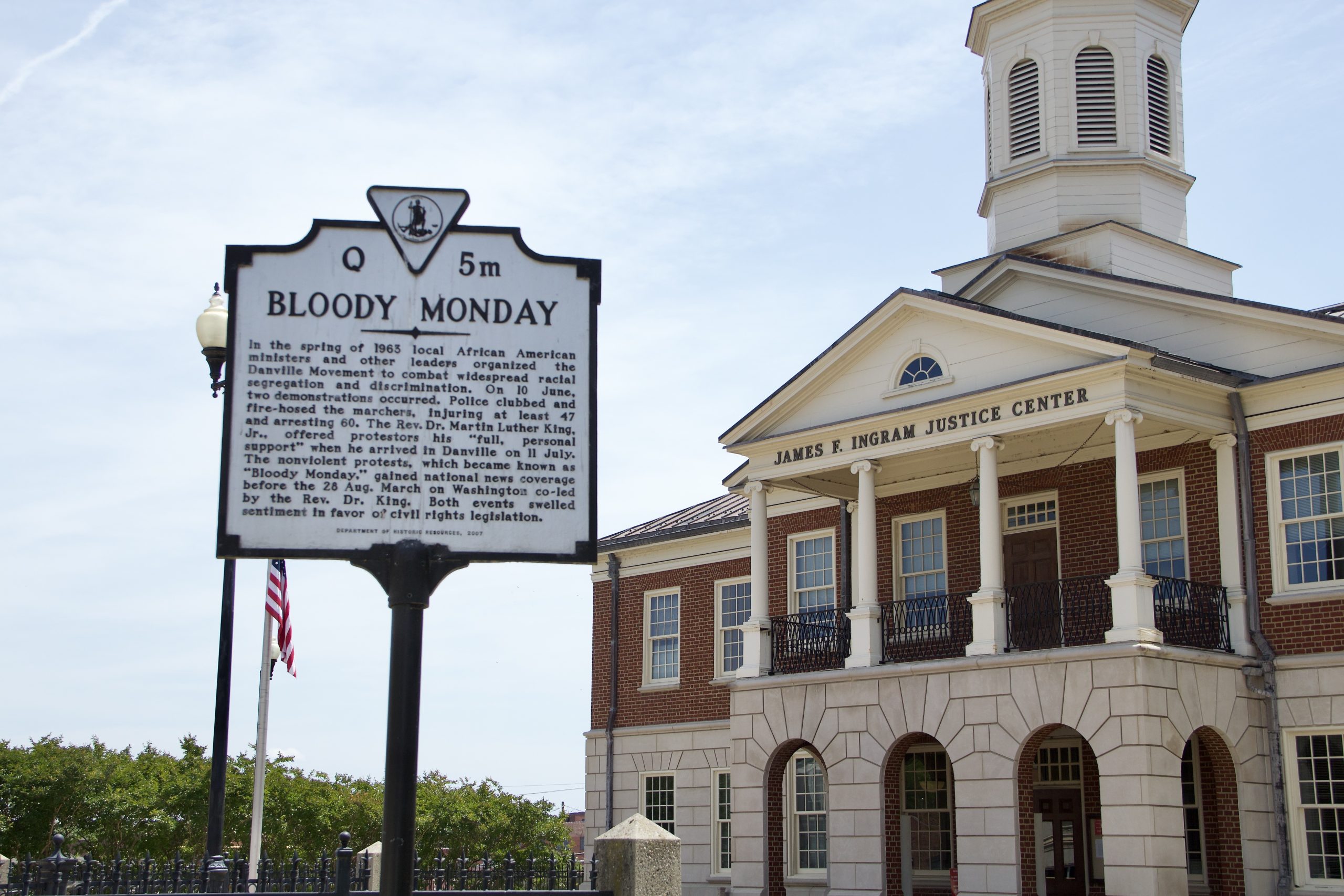A photo of the Danville courthouse, with a historical marker about Bloody Monday in the foreground.