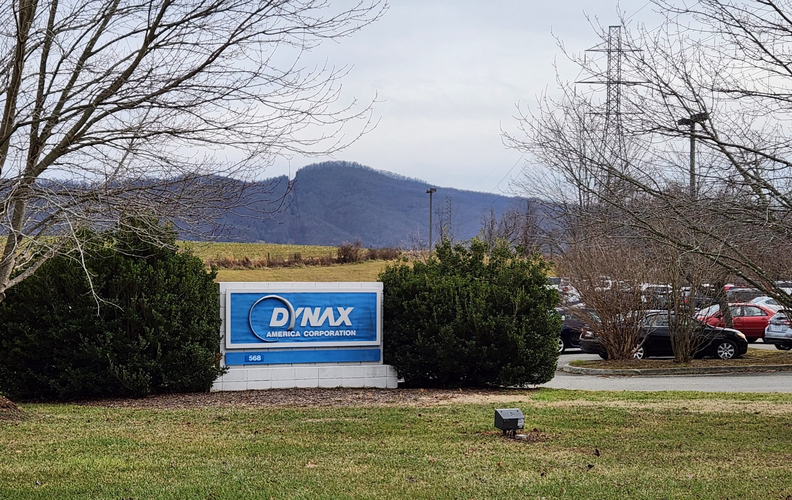 Dynax sign on a green lawn