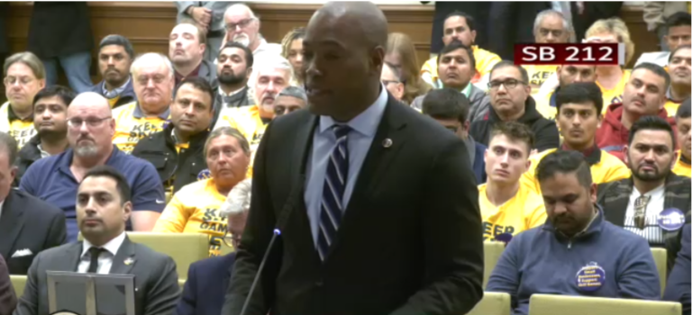 Sen. Aaron Rouse, D-Virginia, speaks on behalf of skill games. Supporters, who included many convenience store operators, wore yellow shirts to indicate their support.