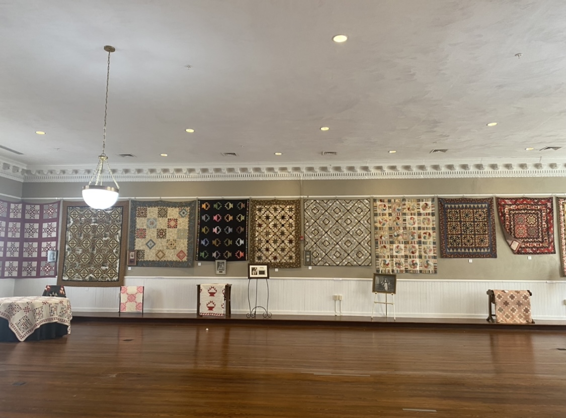 Twenty custom quilts made by Indianapolis-based quilter Kaye England line the walls of Clifton Forge’s Historic Masonic Theatre. The quilts will be auctioned off in a fundraiser for the theatre March 9. Photo by Shauna Muckle.