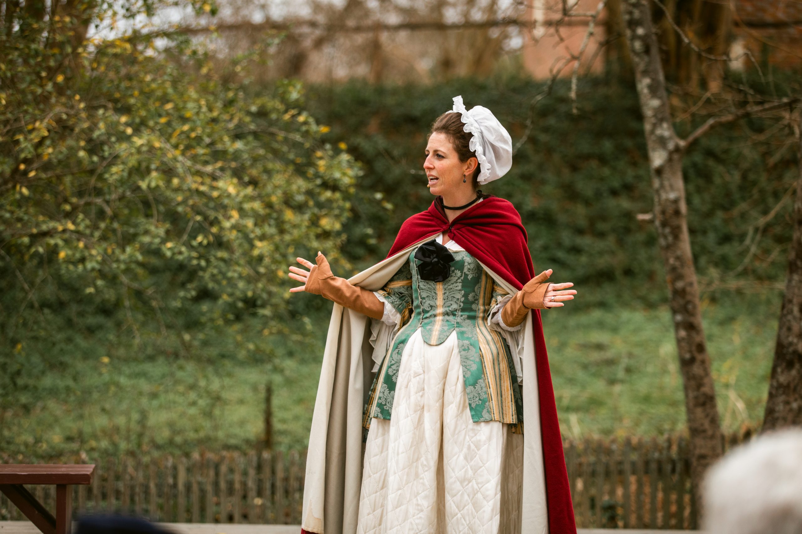 Visitors to The Colonial Williamsburg Foundation attend a program with Nation Builder Martha Washington, portrayed by Katharine Pittman.