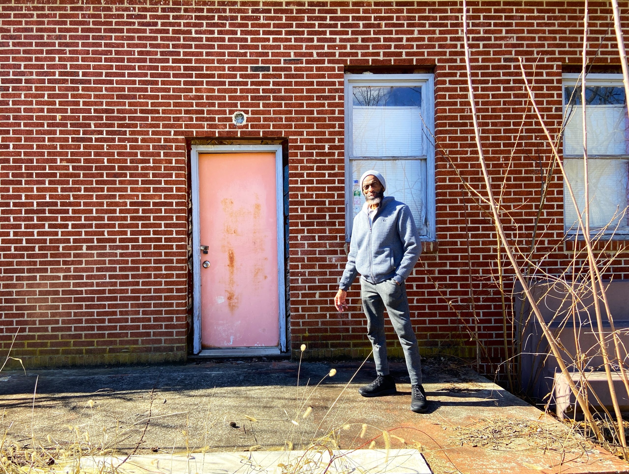 Jerry Jones stands outside the old red brick Glade Spring School.