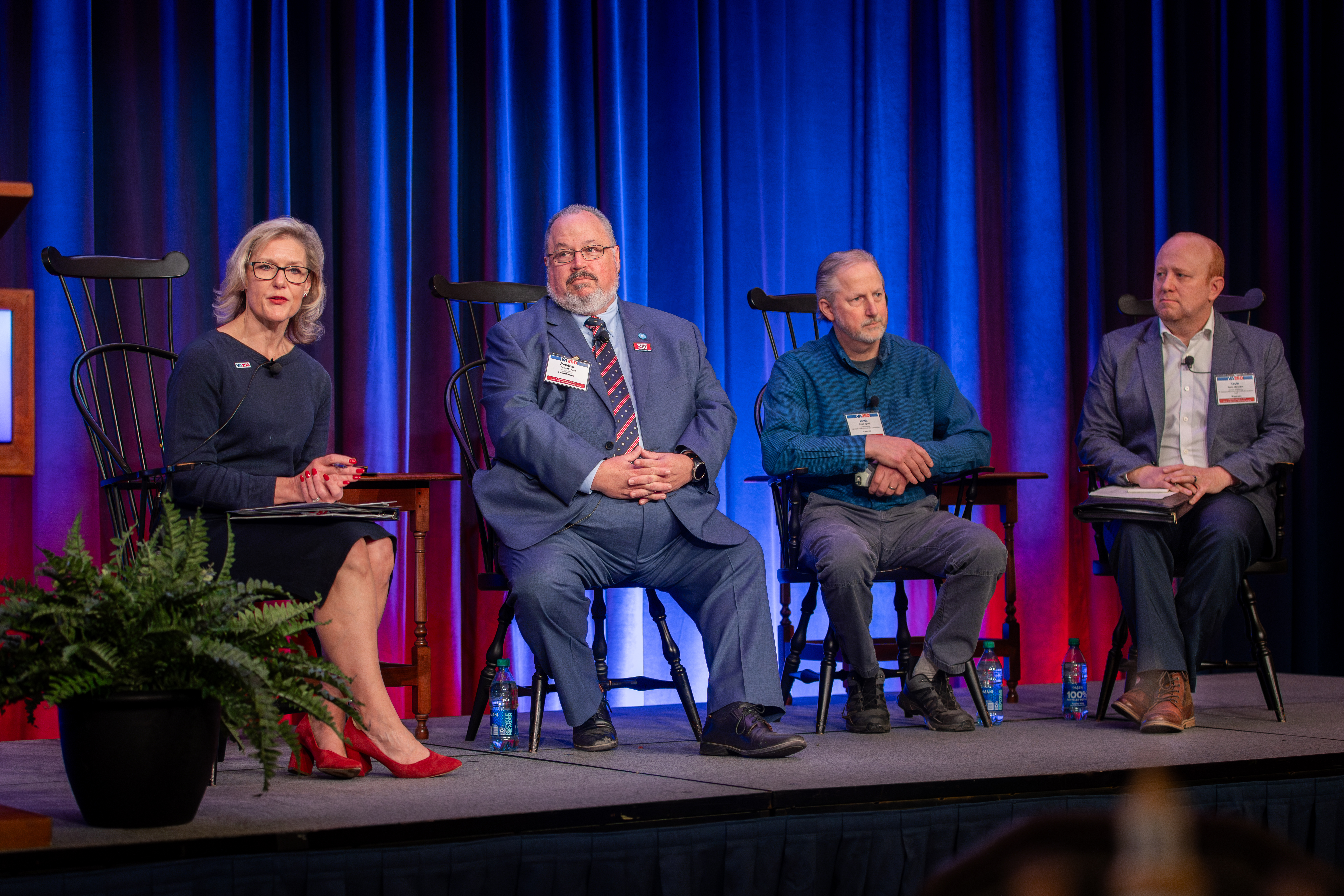 Four people on a stage.