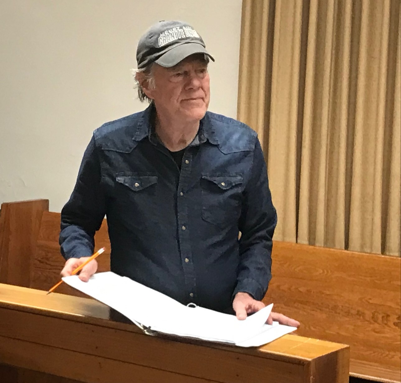 Playwright watches rehearsal