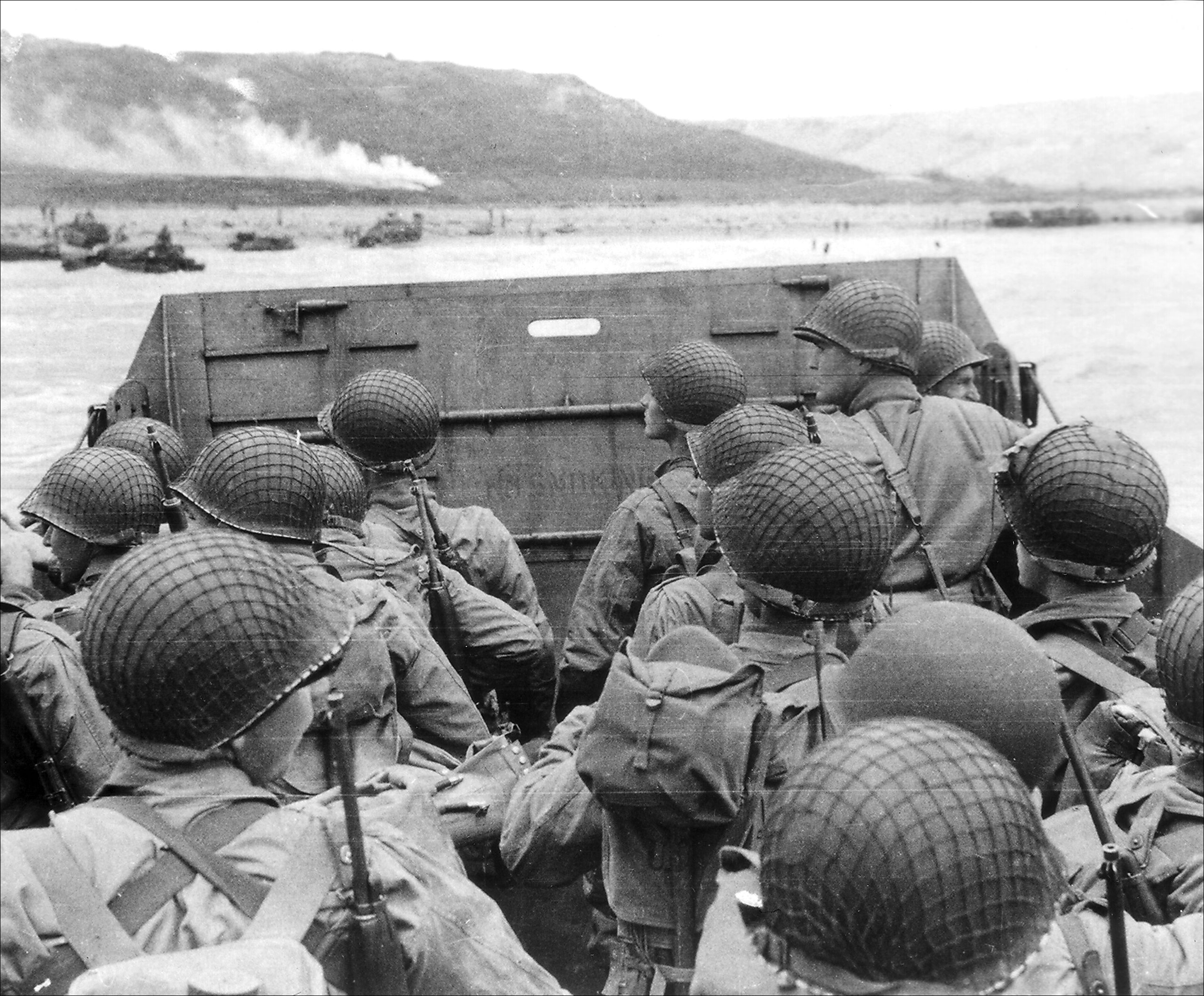 Soldiers come ashore on one of the later waves. Courtesy of National Archives and the National World War 2 Museum.