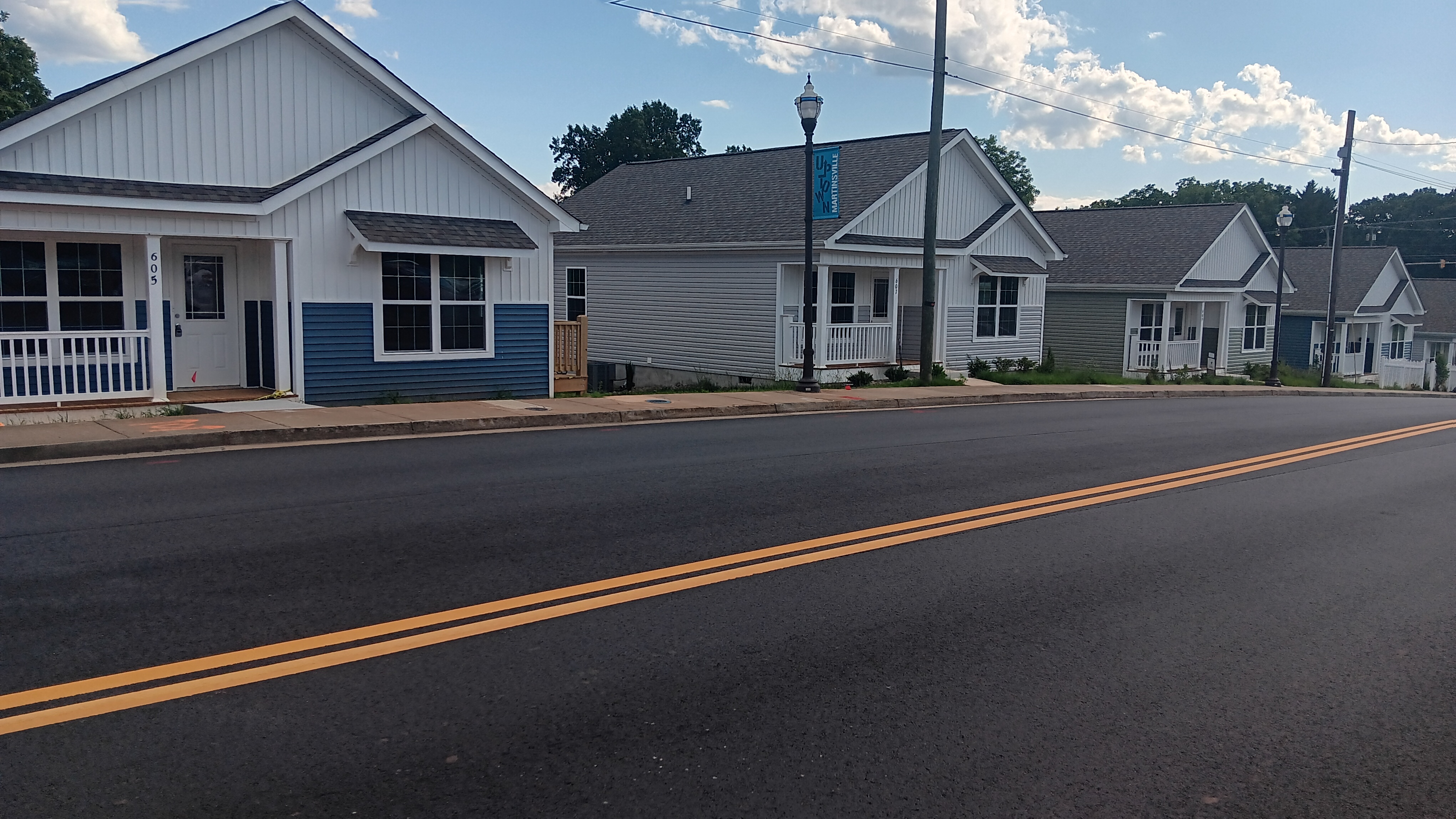 A row of small houses lines a street.