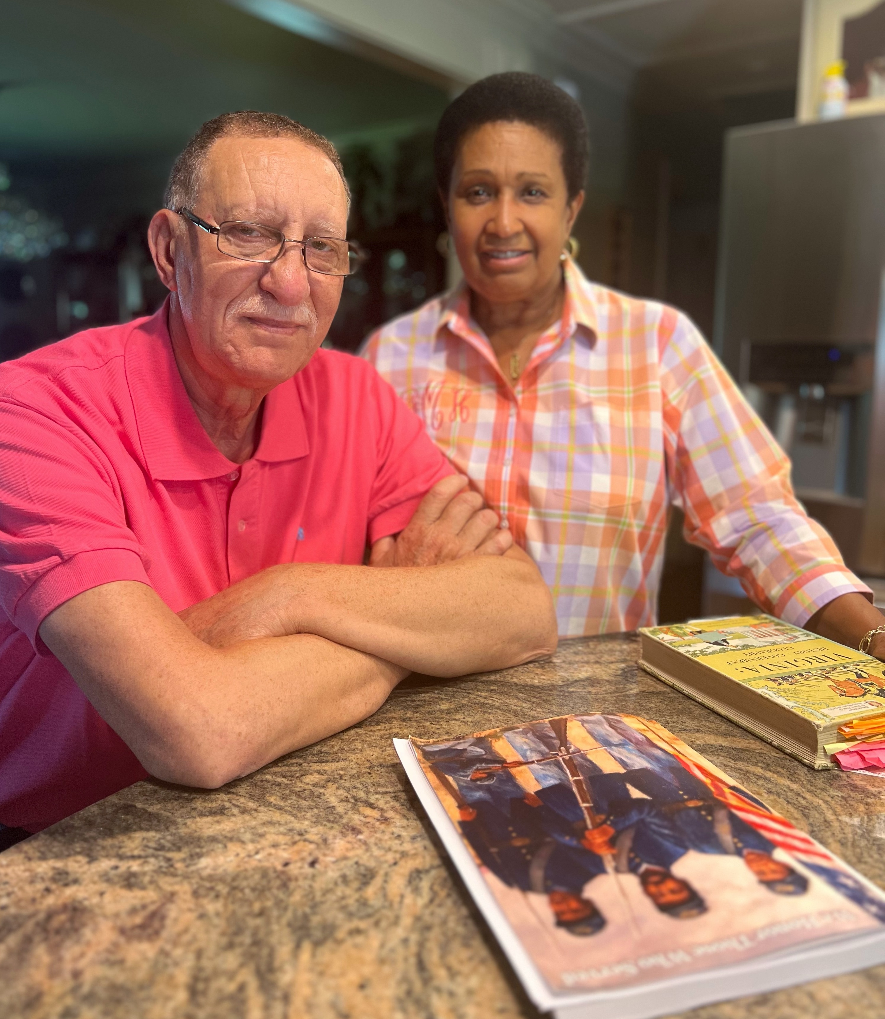 Larry and Glenna Moore at their kitchen table.