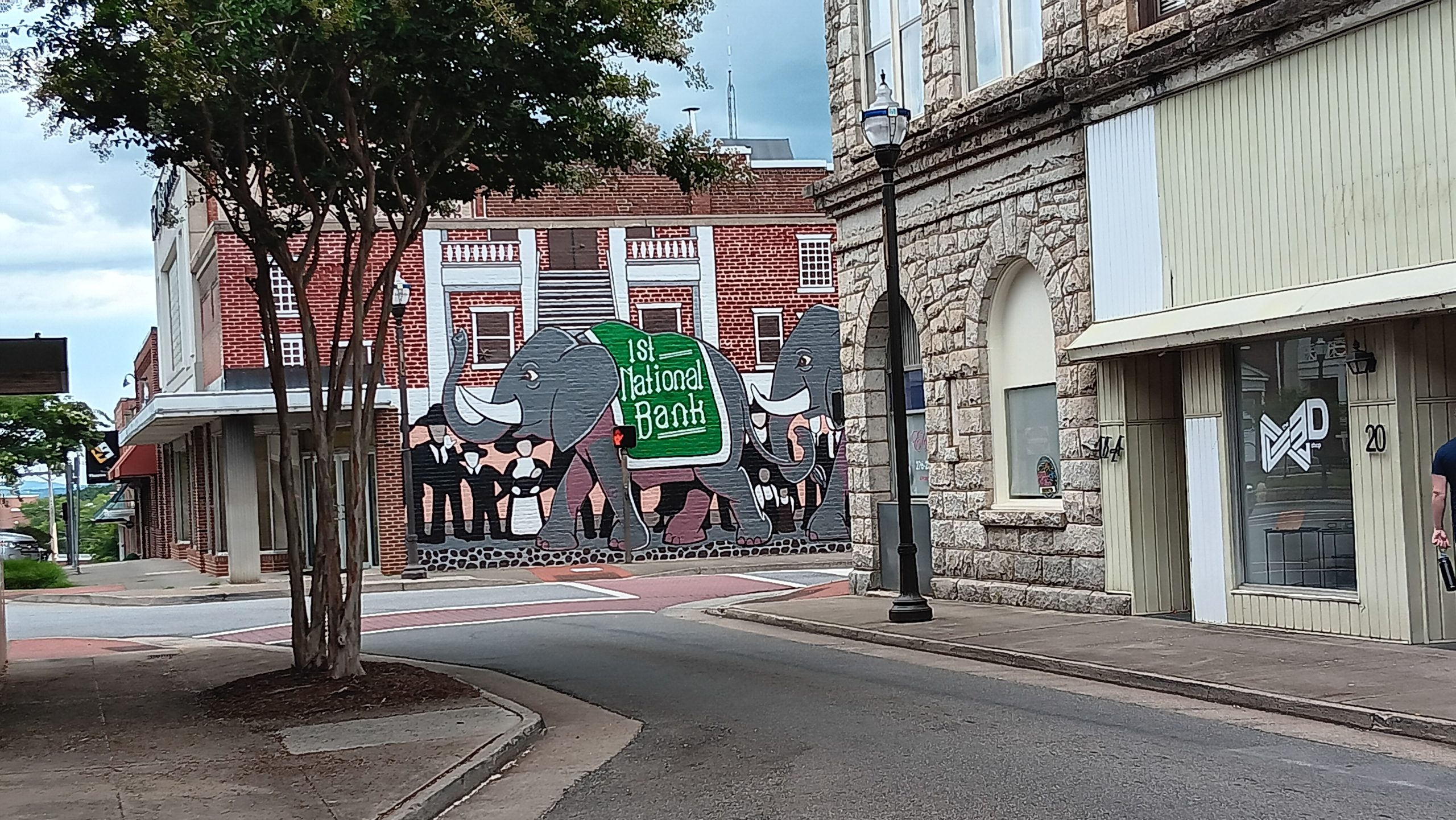 A street in Uptown Martinsville, with a building in the background featuring a mural of an elephant.