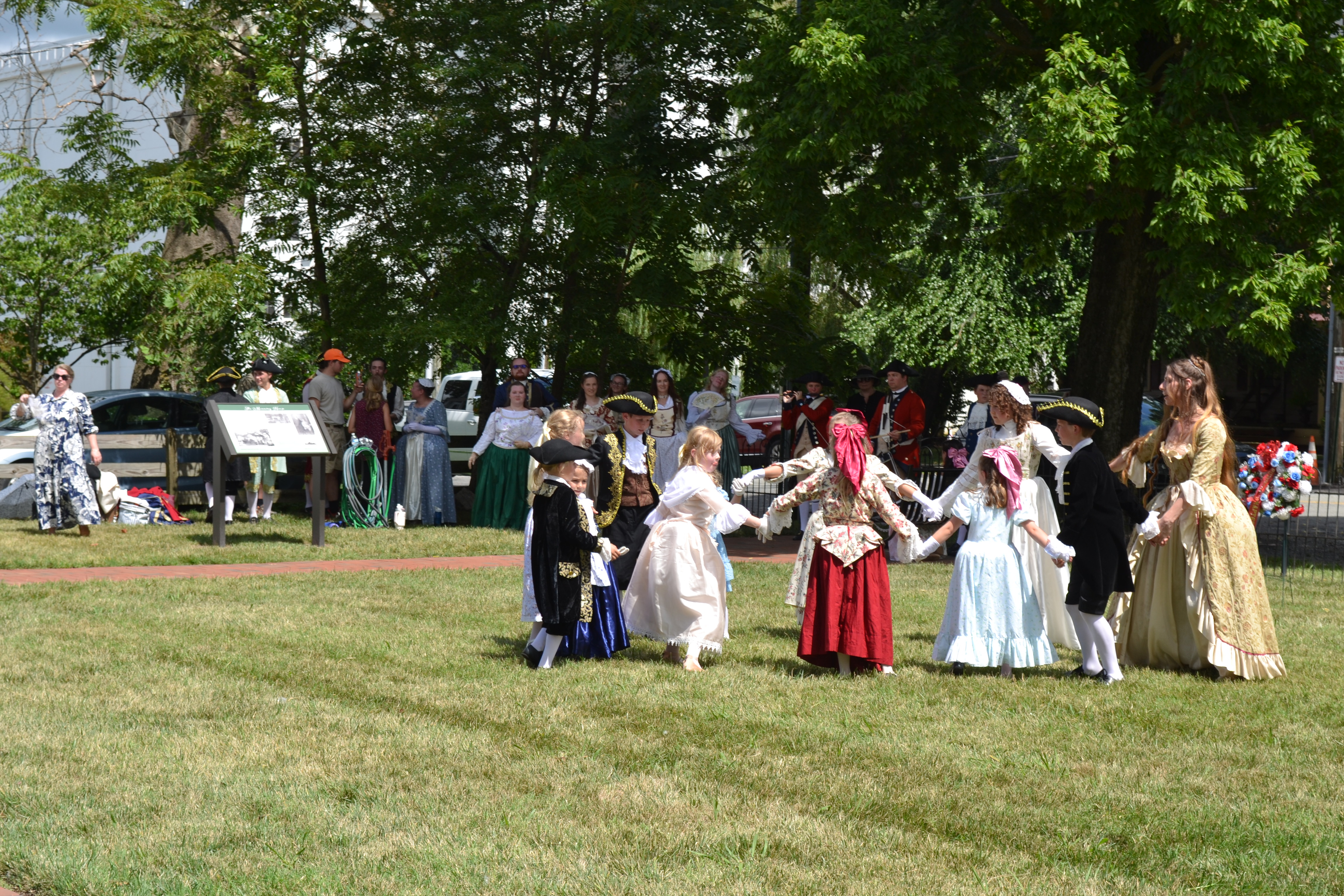 Children play in colonial costume. Photo by Lindley Estes.