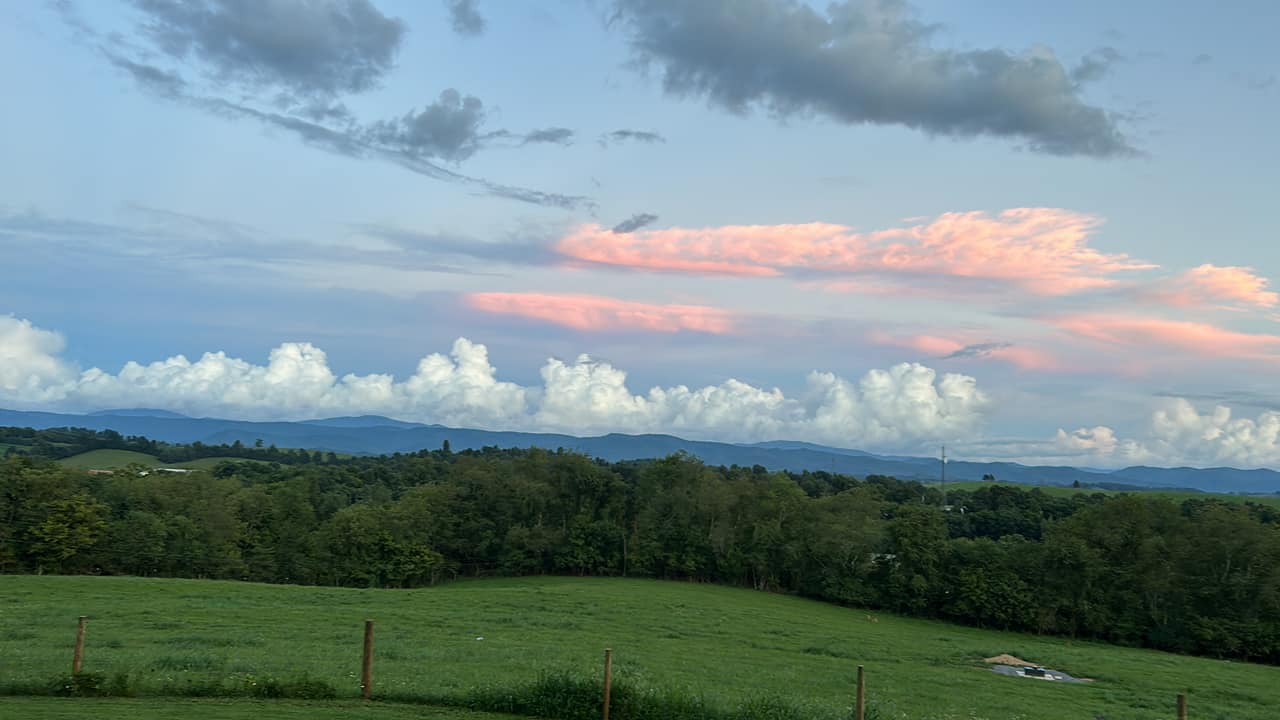 Towering cumulus clouds line up beyond a ridgeline as seen from a Washington County farm earlier in August. Courtesy of Carolyn Wilson.