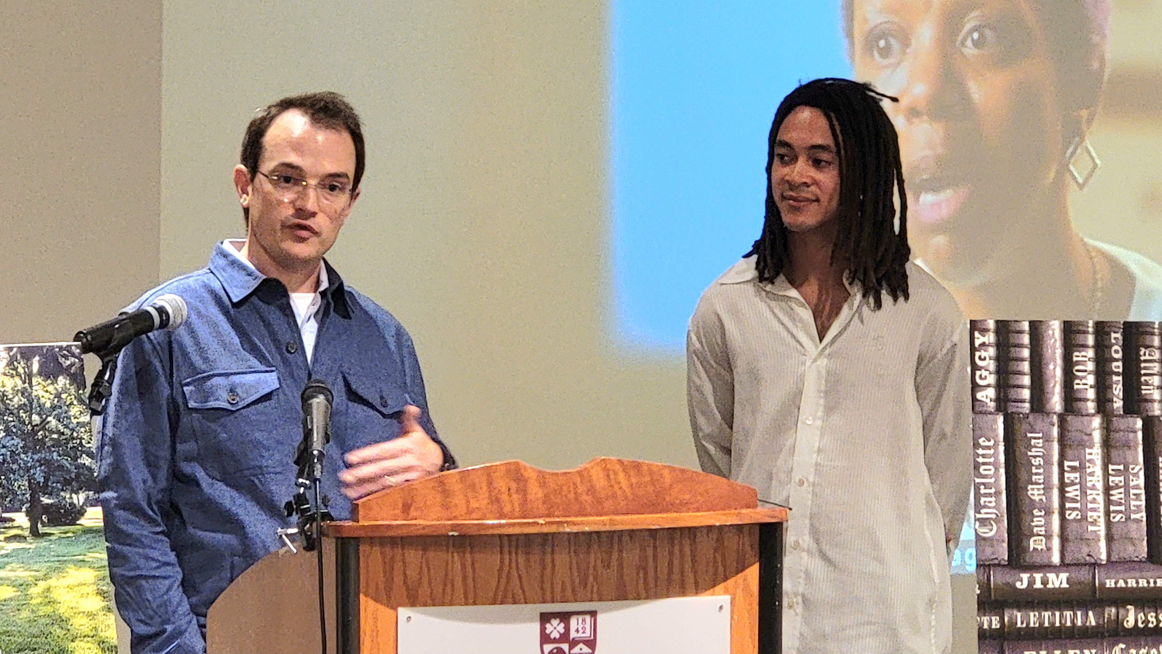 Roanoke College Historian Jesse Bucher, left, discusses efforts to memorialize enslaved people who played a role in establishing the school. At right is artist Sandy Williams IV. Photo by Kate Flannigan.