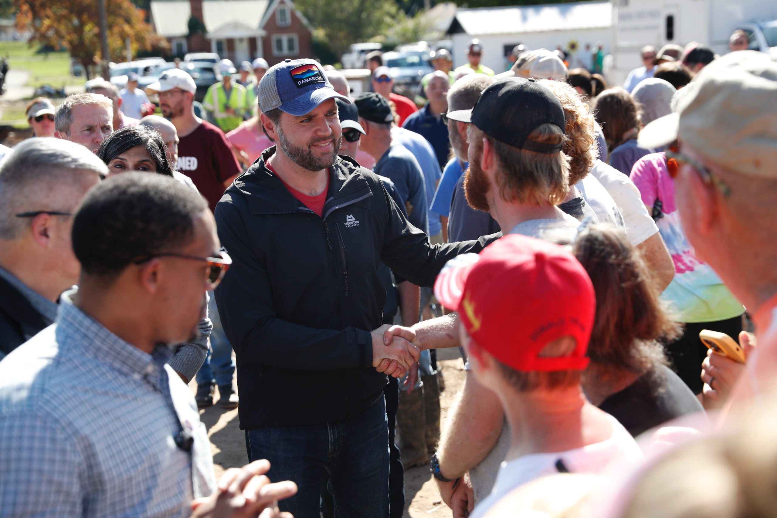 JD Vance shakes hands in a crowd in Damascus