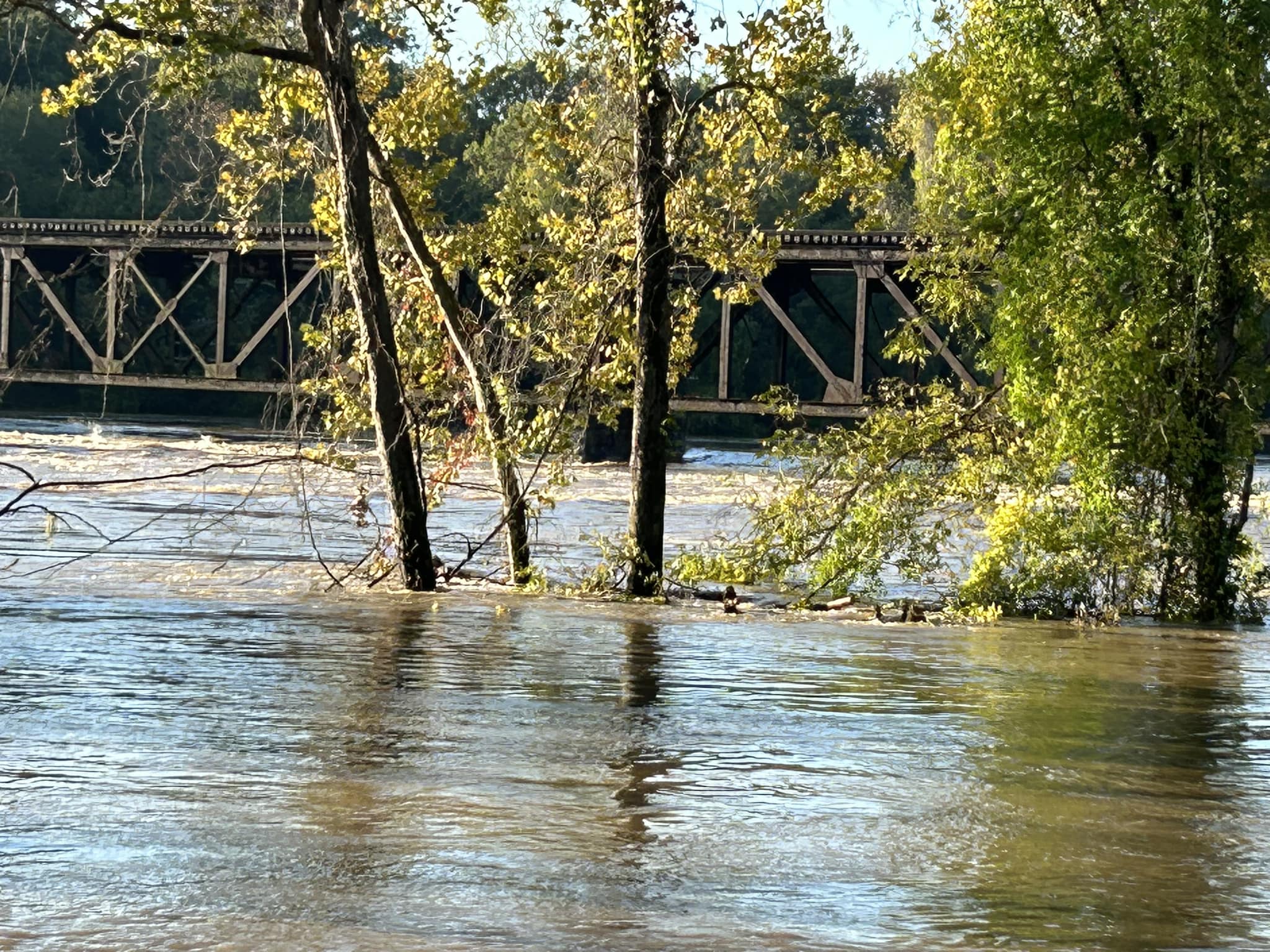 Water on the New River rises nearly to a railroad trestle following the heavy rains from the inland circulation of Hurricane Helene on Friday. Courtesy of Pulaski County.