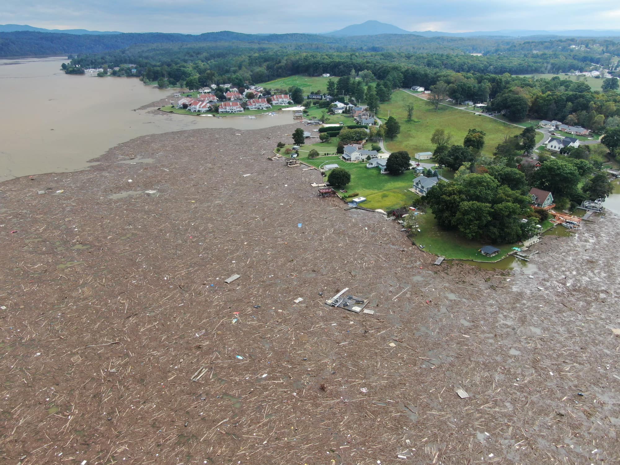Debris from upstream flooding of the New River spreads across Claytor Lake. Courtesy of Pulaski County..