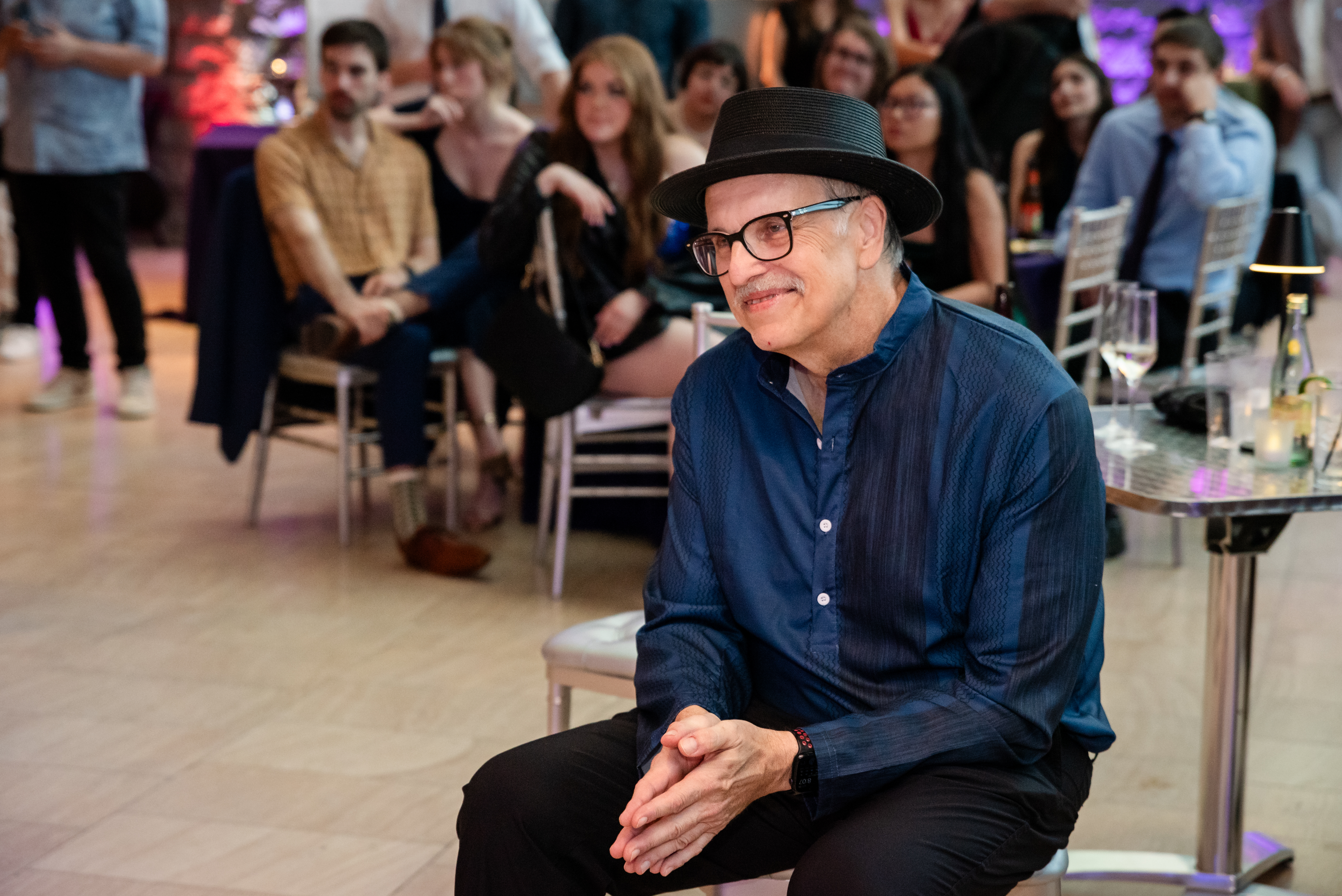 Warren Bickel sits at foreground of a crowd that he hosted in June, a "Fare The Well" party at Taubman Museum of Art, in Roanoke. Bickel, diagnosed in May with pancreatic cancer, died on Sept. 28, at 68.