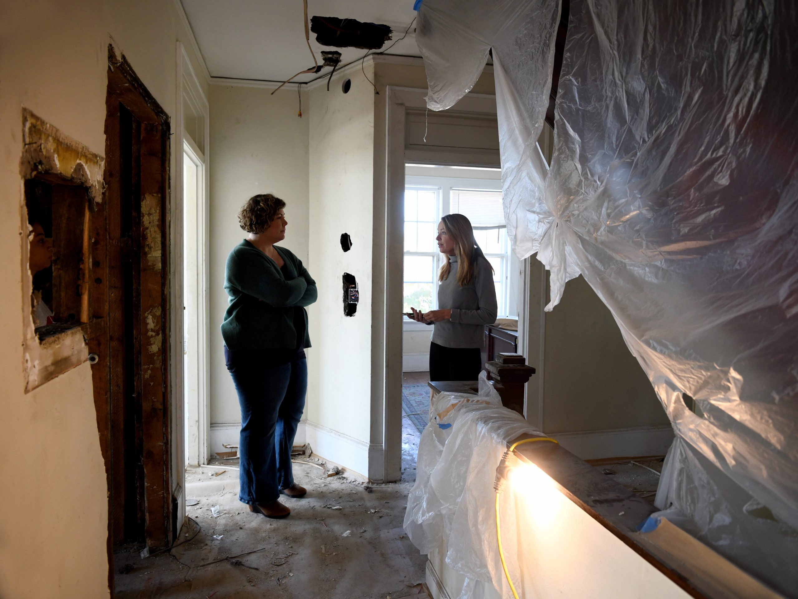 Ali Hamed-Moore, Chief of Compliance at Anderson Treatment, and Isabel Thornton, Executive Director at Restoration Housing, walk through the construction site of The Grove on Patterson, a residential treatment facility for women and children set to open in 2025.