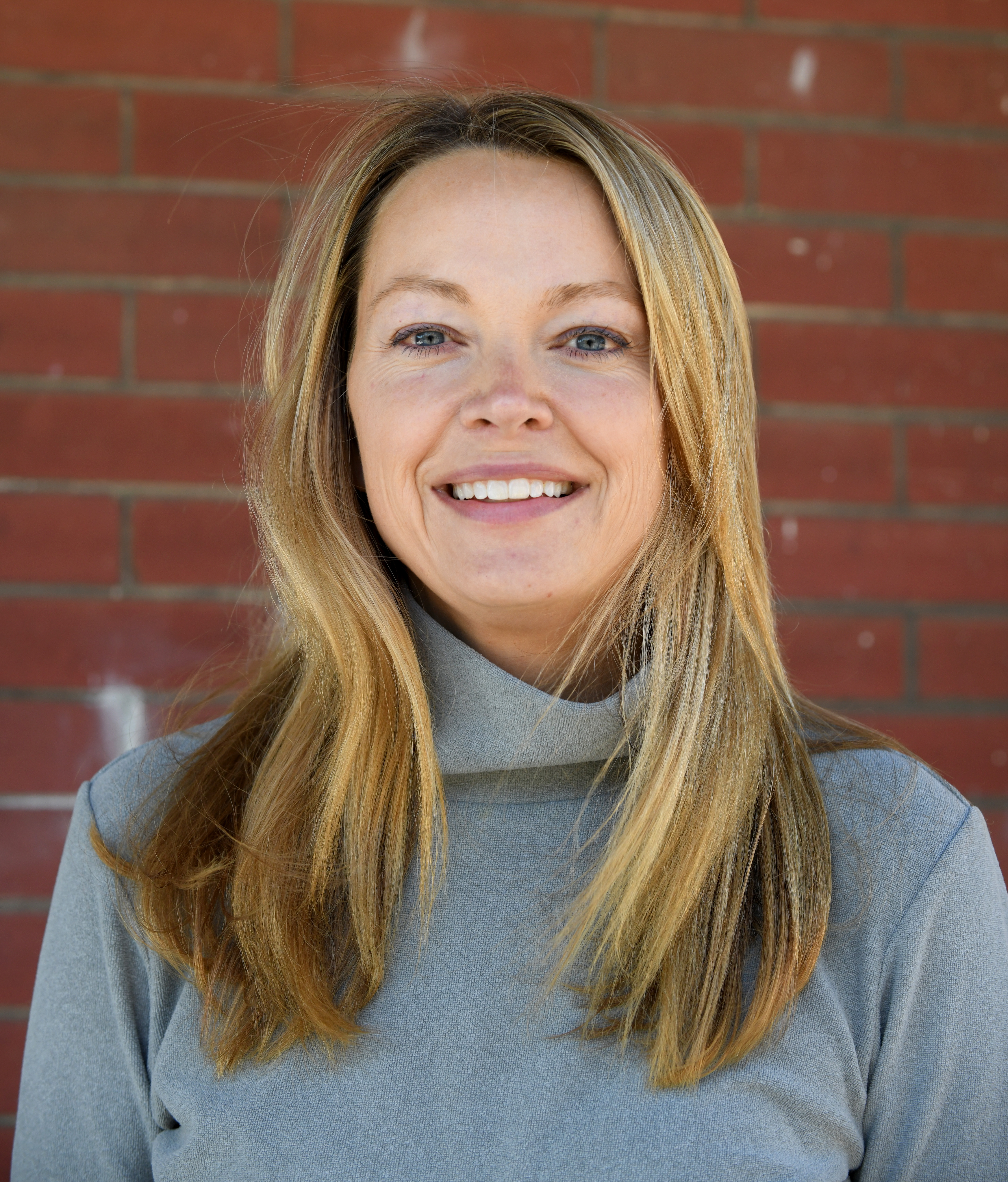 Isabel Thornton, Executive Director at Restoration Housing stands outside of the future home of The Grove on Patterson, a new residential addiction treatment program for women in Roanoke.