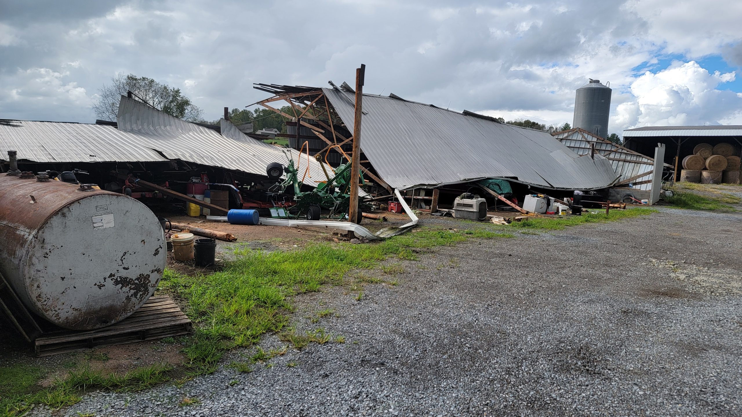 A damaged structure on a farm.