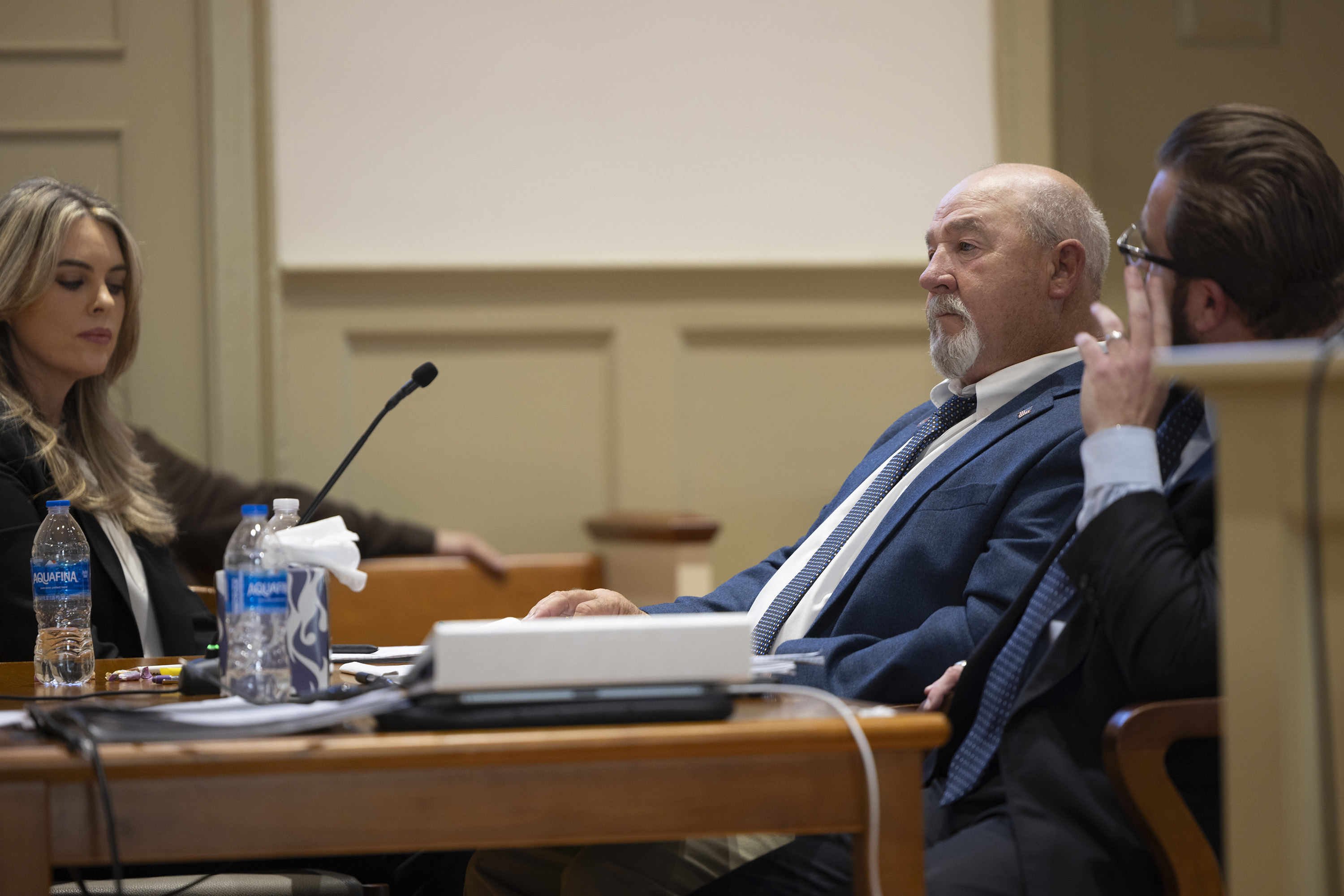 LOVINGSTON,VA OCTOBER 28: Richardson Carter Bell, center, at the defense table with his Lawyer Matthew L. Pack, right, and Caryn Pack part of the defense team Monday, October 28, 2024 in Lovingston, Va. at the Nelson County Circuit Court for the voting trial of The Commonwealth of Virginia vs Bell. The defendant Richardson Carter Bell, is accused of attempting to vote twice in the local elections in 2023. Matthew L. Pack, is the Defense attorney, the Michael R. Doucette, Nelson County Circuit Court Judge. Representing the state is Daniel L. Rutherford, Commonwealth’s Attorney along with Quinn Conrad is the Assistant Commonwealth’s Attorney. (Photo by Justin Ide/POOL/ for The Washington Post)