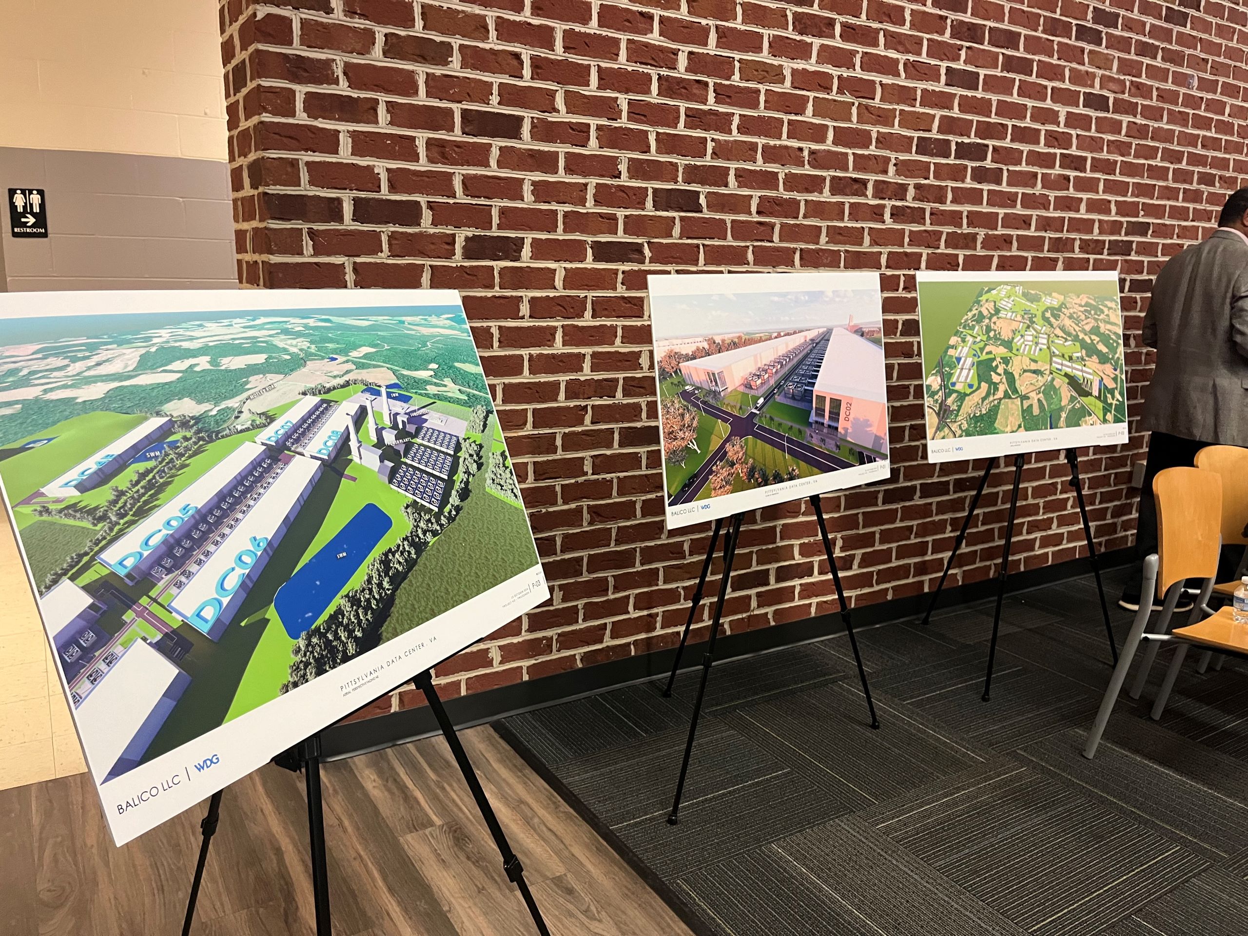 three boards that depict renderings of the balico power plant and data center were displayed at the Chatham community outreach meeting.