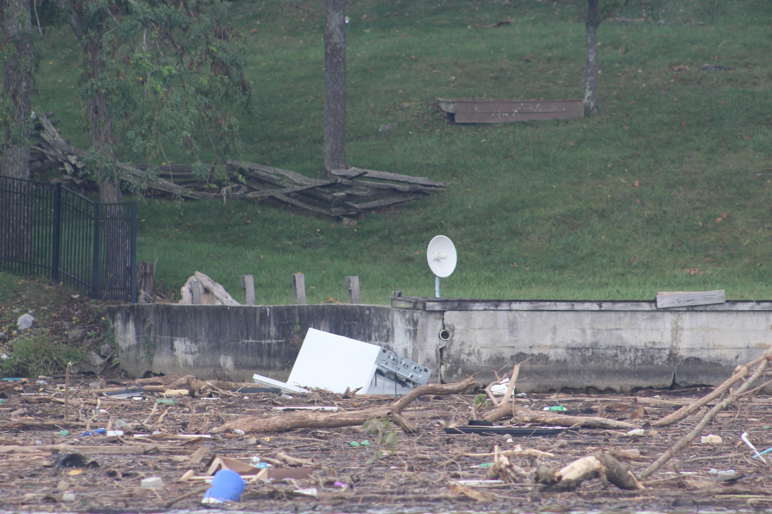 An appliance floats among other debris near the dam at Claytor Lake