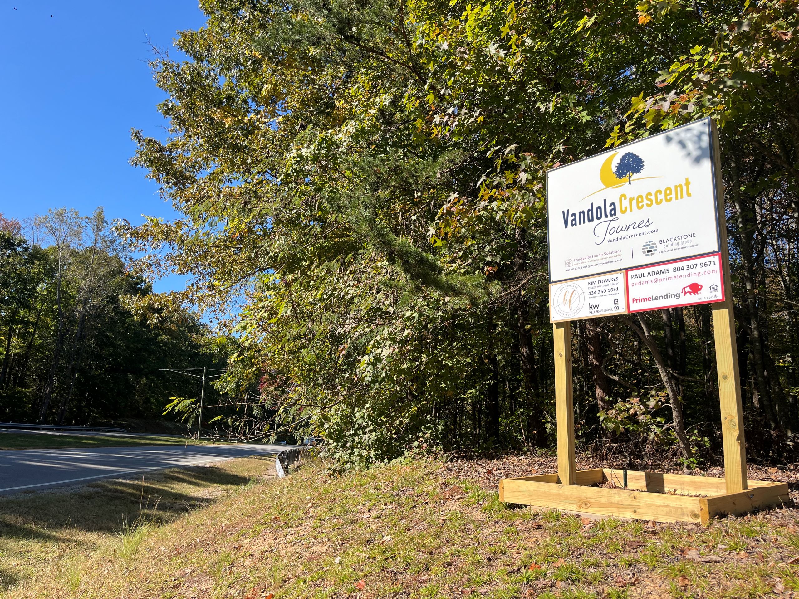 a sign for a housing development, Vandola Crescent Townes, stands on the side of U.S. 58 through Danville