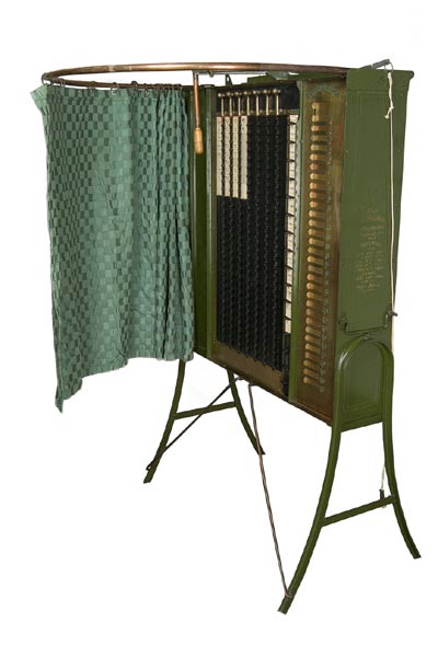 This voting machine by the Standard Voting Machine Company of Rochester, New York, was marketed in the 1890s. Like the voting machines we later came to know, it has a privacy curtain. Courtesy of National Museum of American History. 