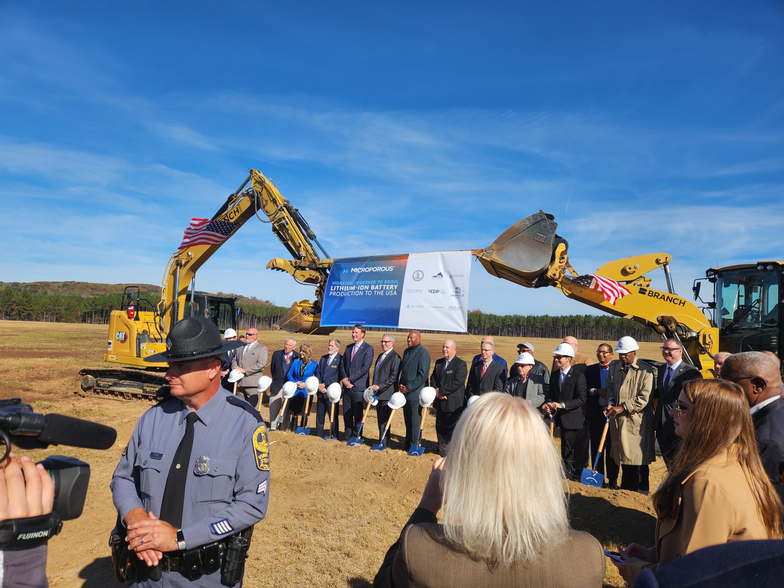 Dignitaries line up to be photographed with Gov. Glenn Youngkin (center) and Microporous CEO John Reeves (to the right). Photo by Dwayne Yancey.