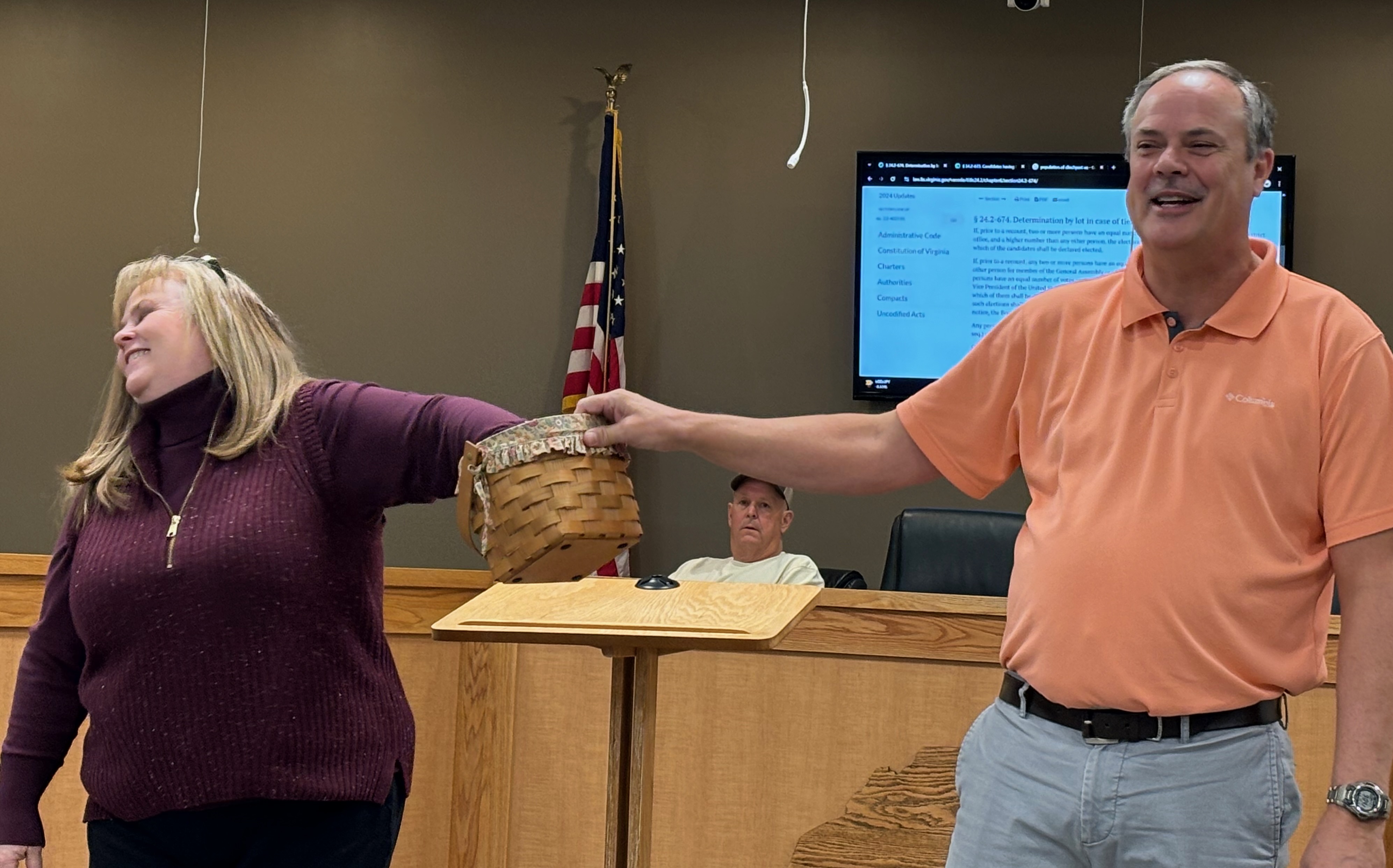Scott County Deputy Registrar Tammy Presley and Registrar Mike Edwards draw the winning egg while Electoral Board Chair Joe Quillen looks on. Photo by Katie Thomason.