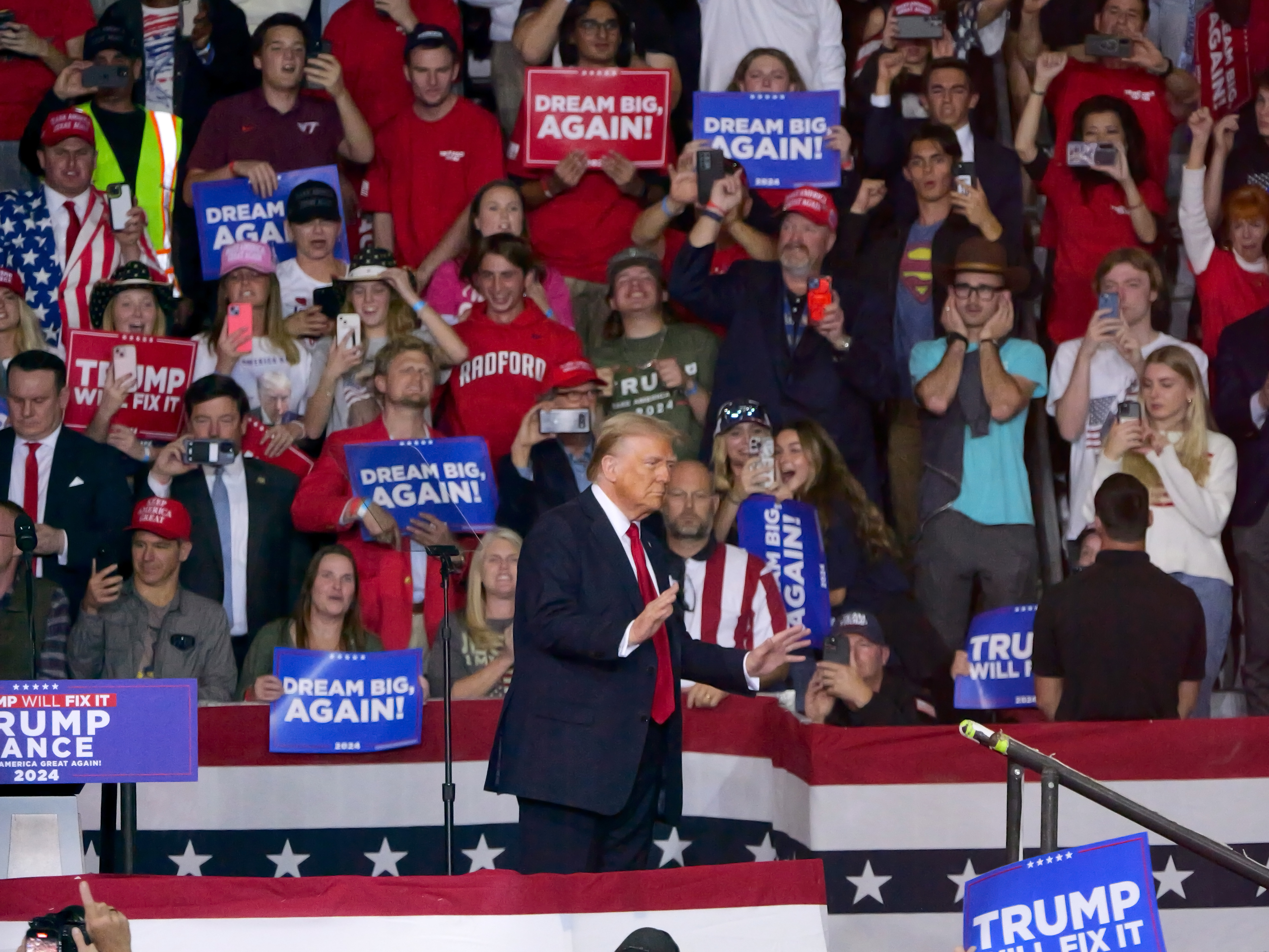 Former president Donald Trump responds to an indoor crowd at Salem Civic Center in Virginia.