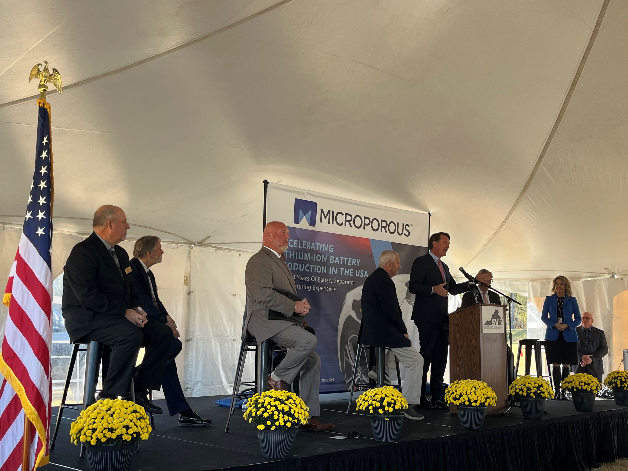 a stage of Virginia state and local officials at the Southern Virginia Megasite at Berry Hill, to announce the Microporous investment.