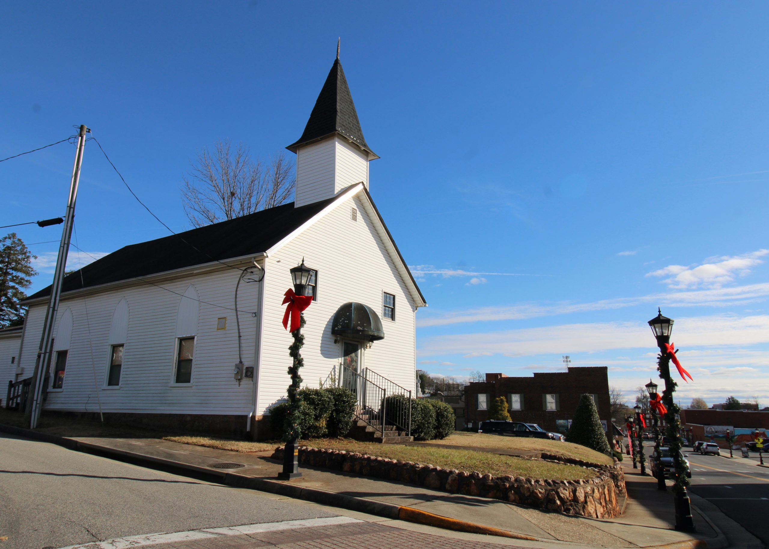 A small white wood frame church building.