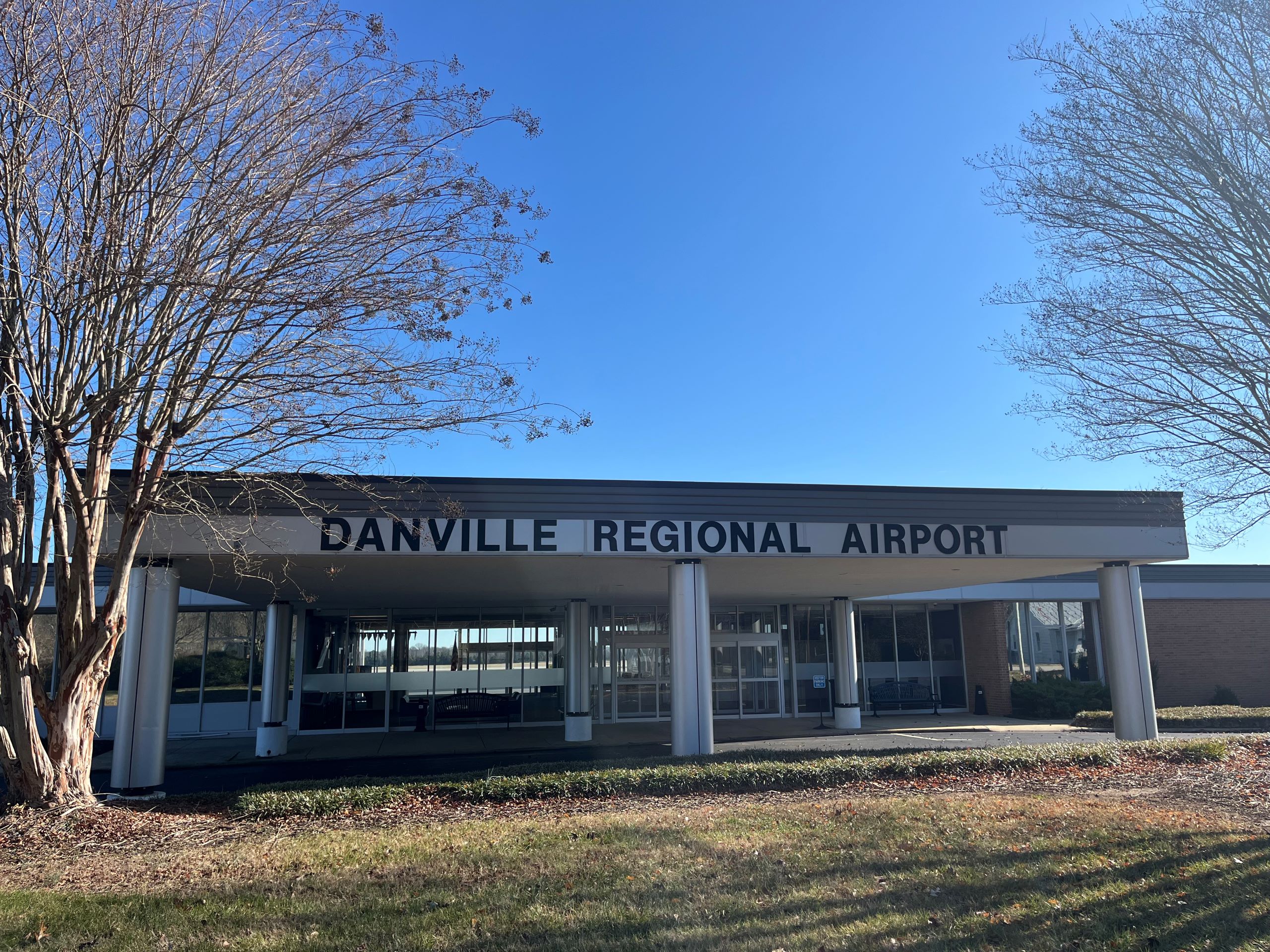 the exterior of a small airport building, the Danville Regional Airport.