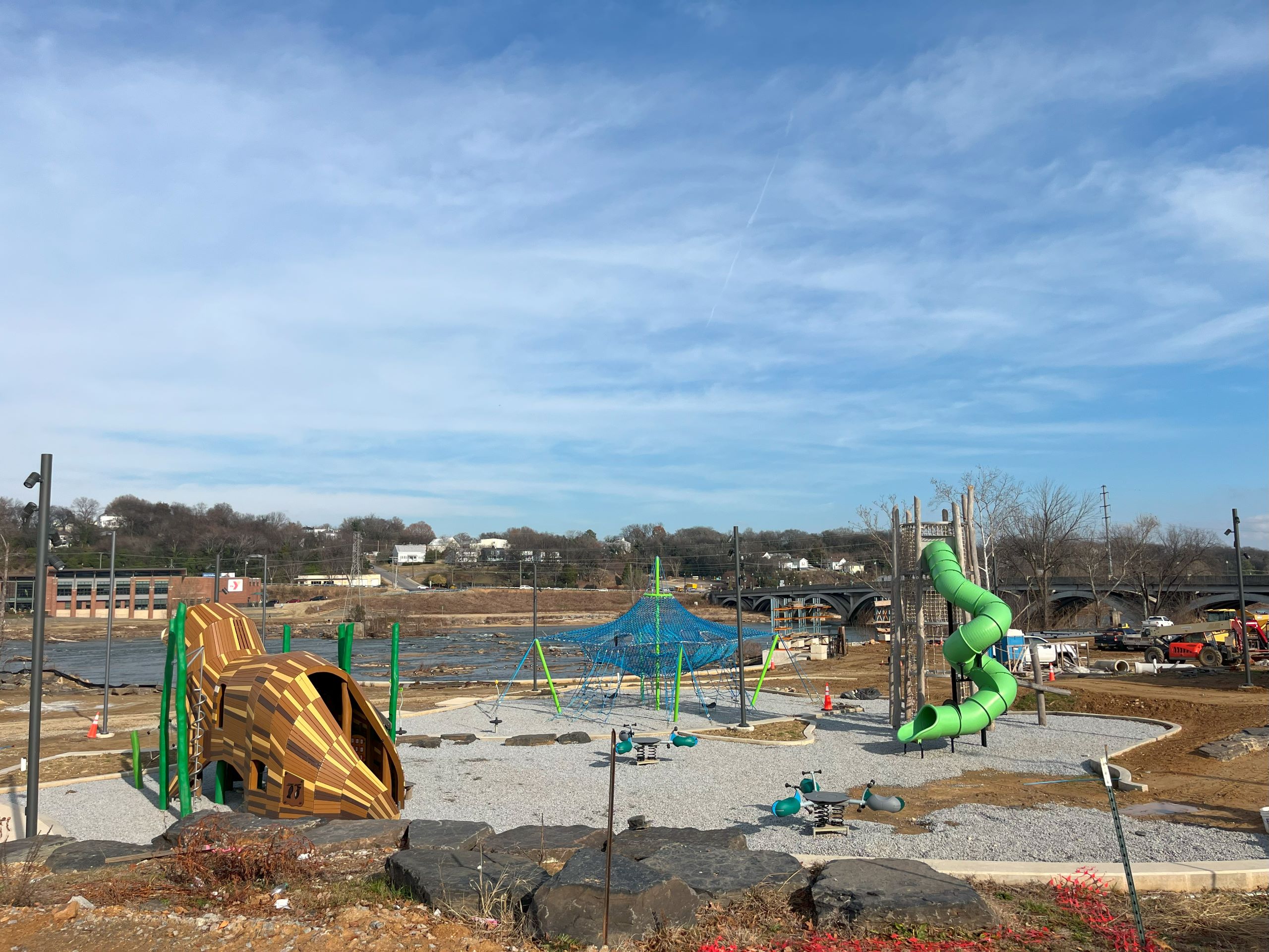 the under-construction river front park in Danville is not complete, but has a gravel area with a playground and other attractions for kids.