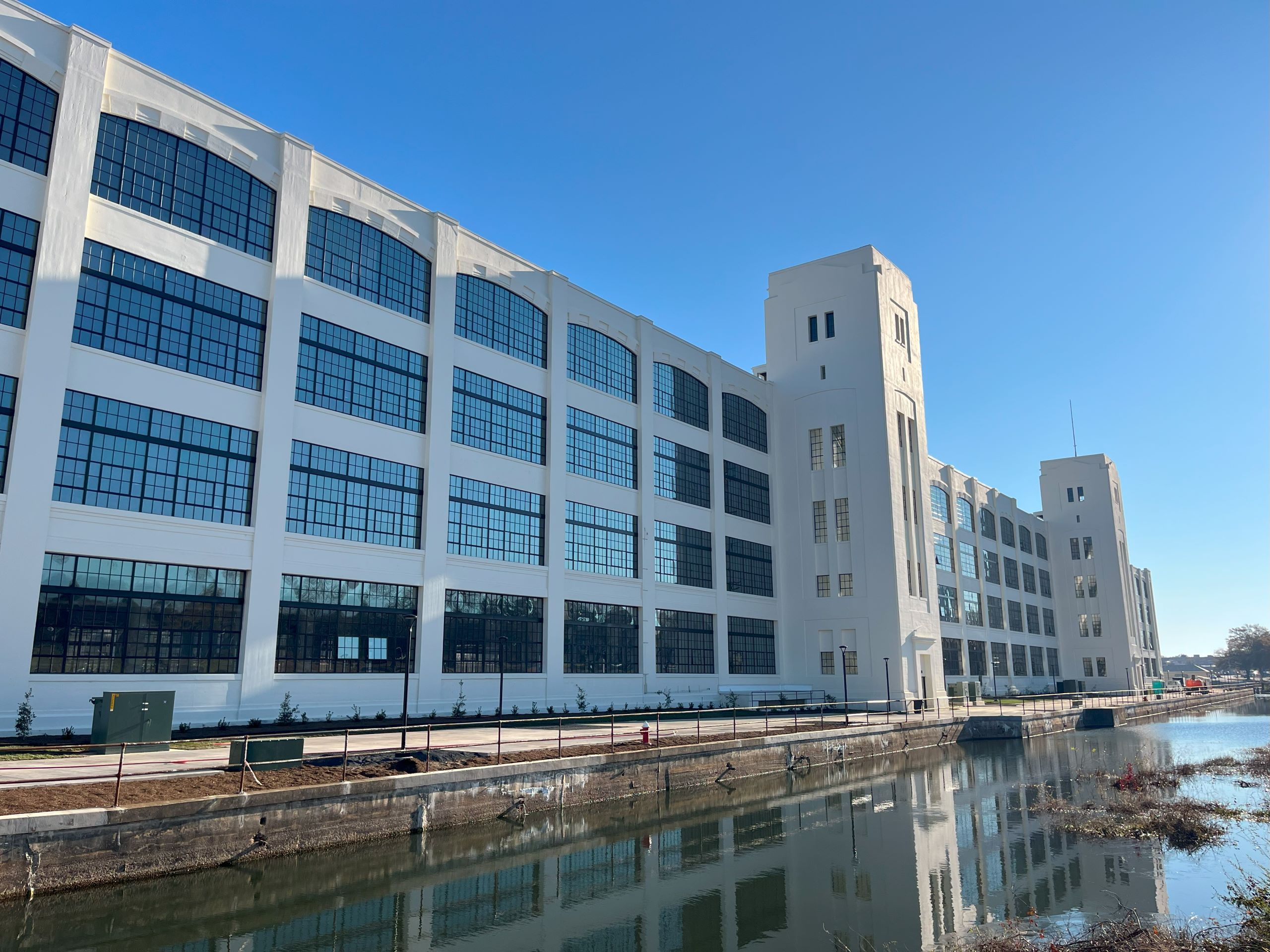 Dan River Falls in Danville, a massive white building with large windows throughout